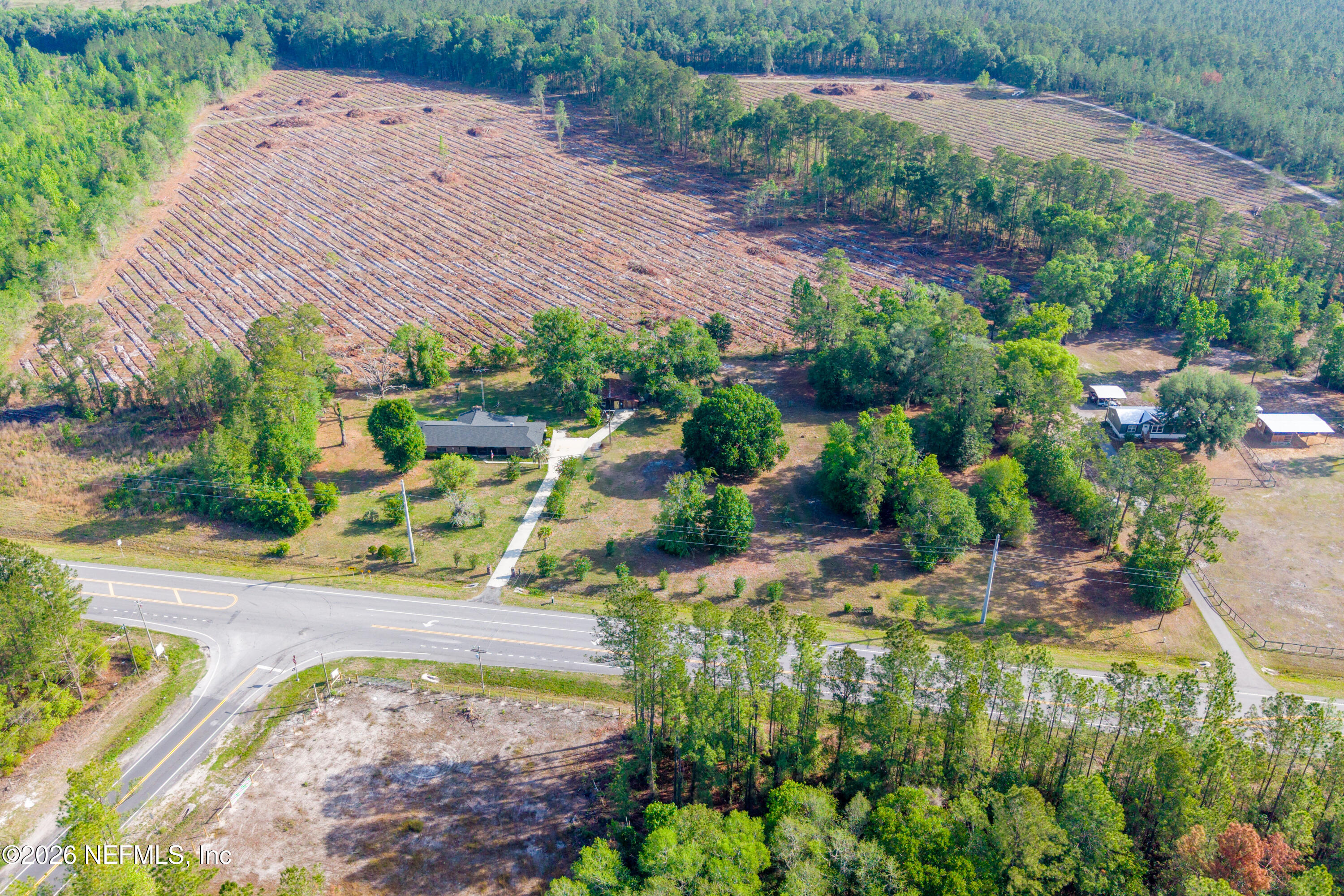 12781 Highway 100 Lake Butler, FL 32054 - Photo 23 of 100 an aerial view of a house with a yard and greenery