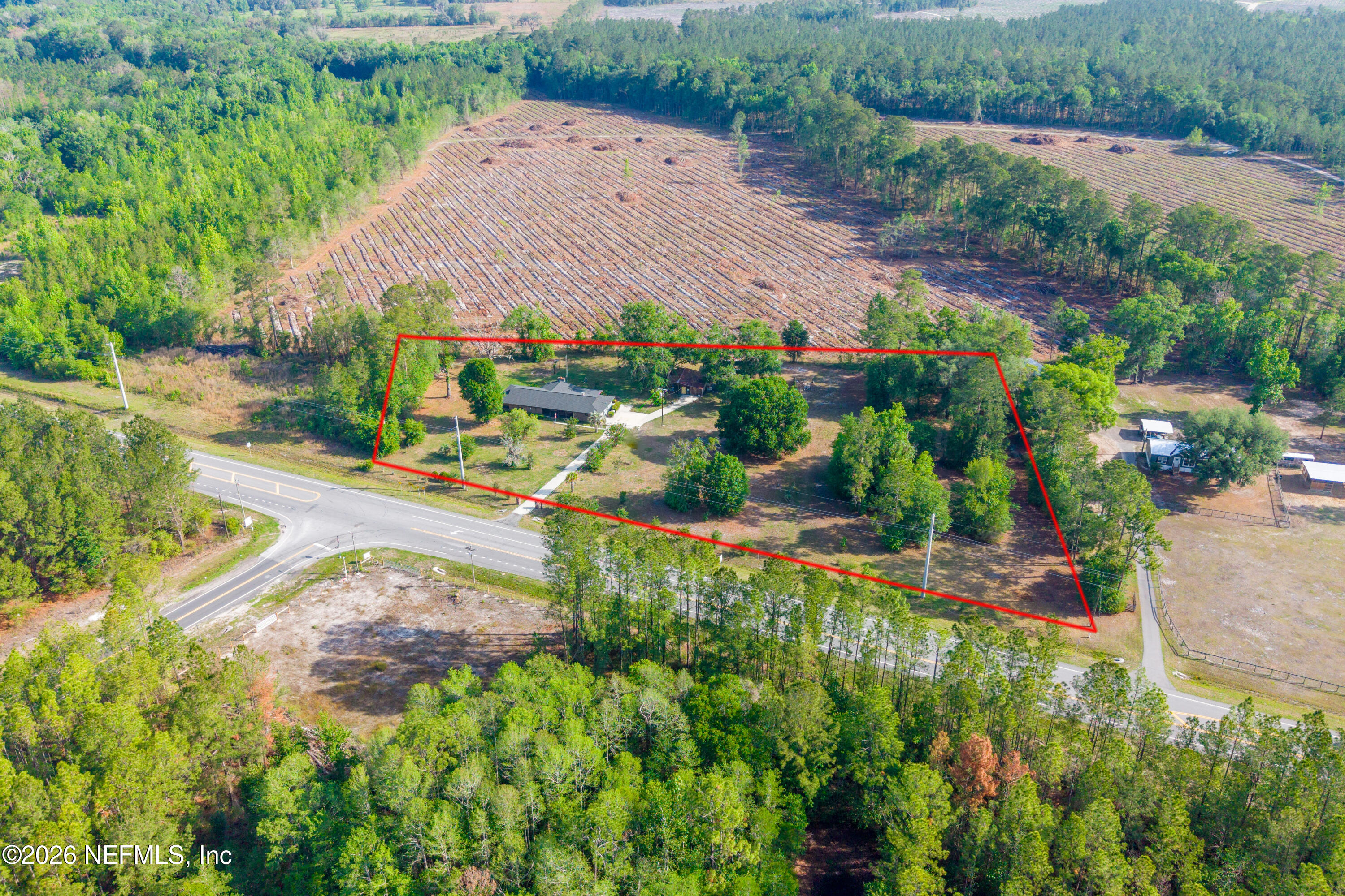 12781 Highway 100 Lake Butler, FL 32054 - Photo 24 of 100 an aerial view of a house with a yard and greenery