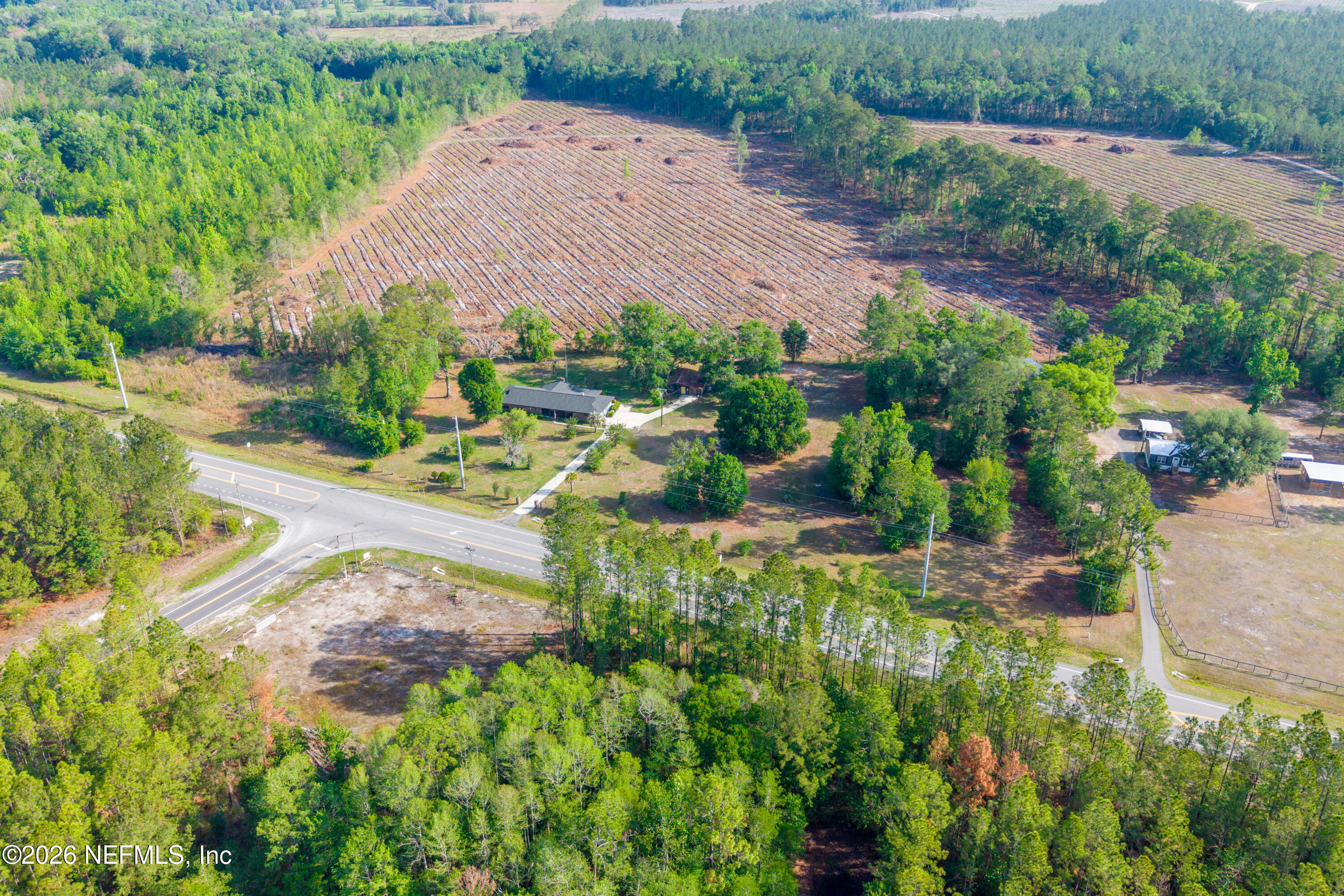12781 Highway 100 Lake Butler, FL 32054 - Photo 25 of 100 an aerial view of a house with a yard and greenery