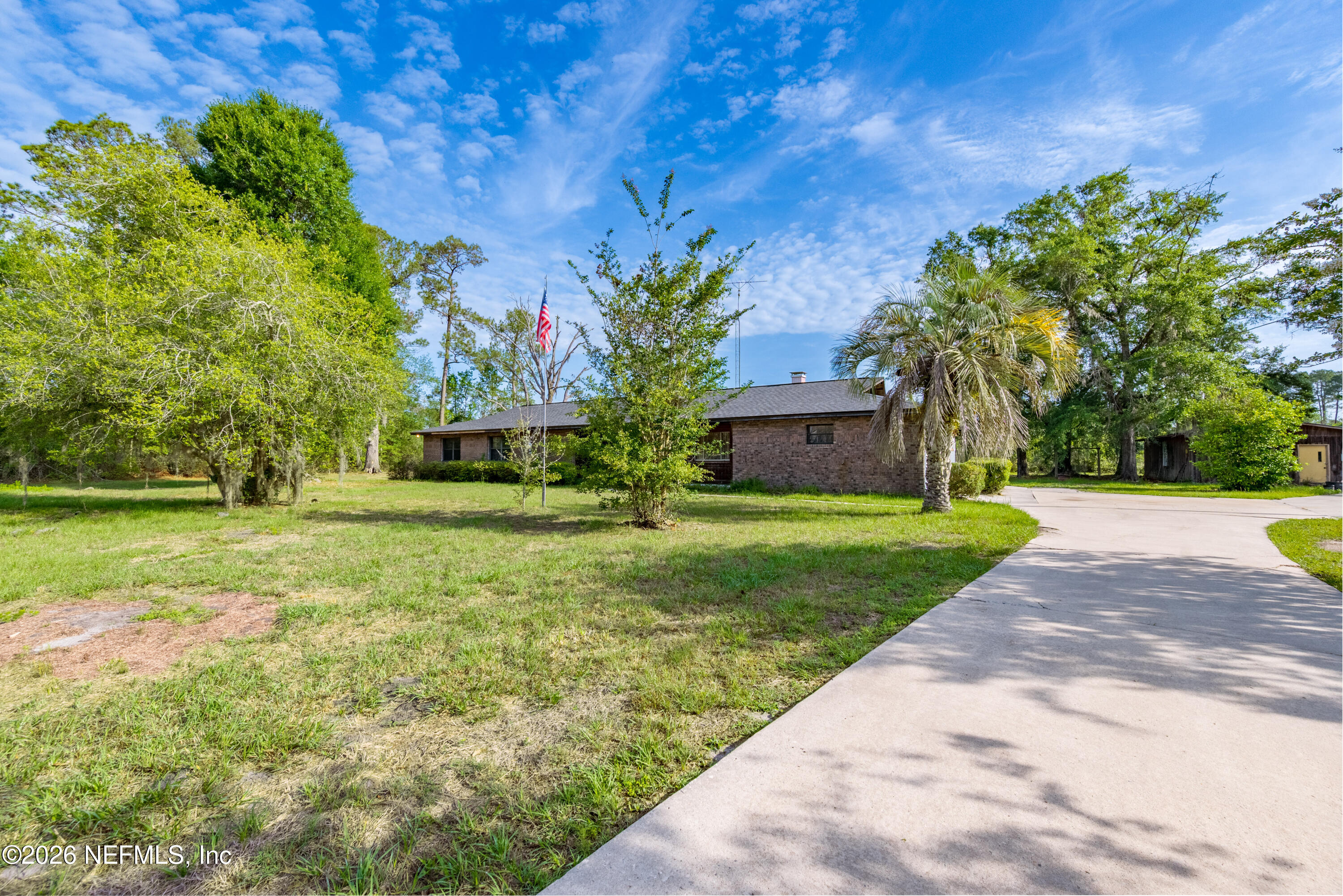 12781 Highway 100 Lake Butler, FL 32054 - Photo 3 of 100 a front view of house with yard and green space