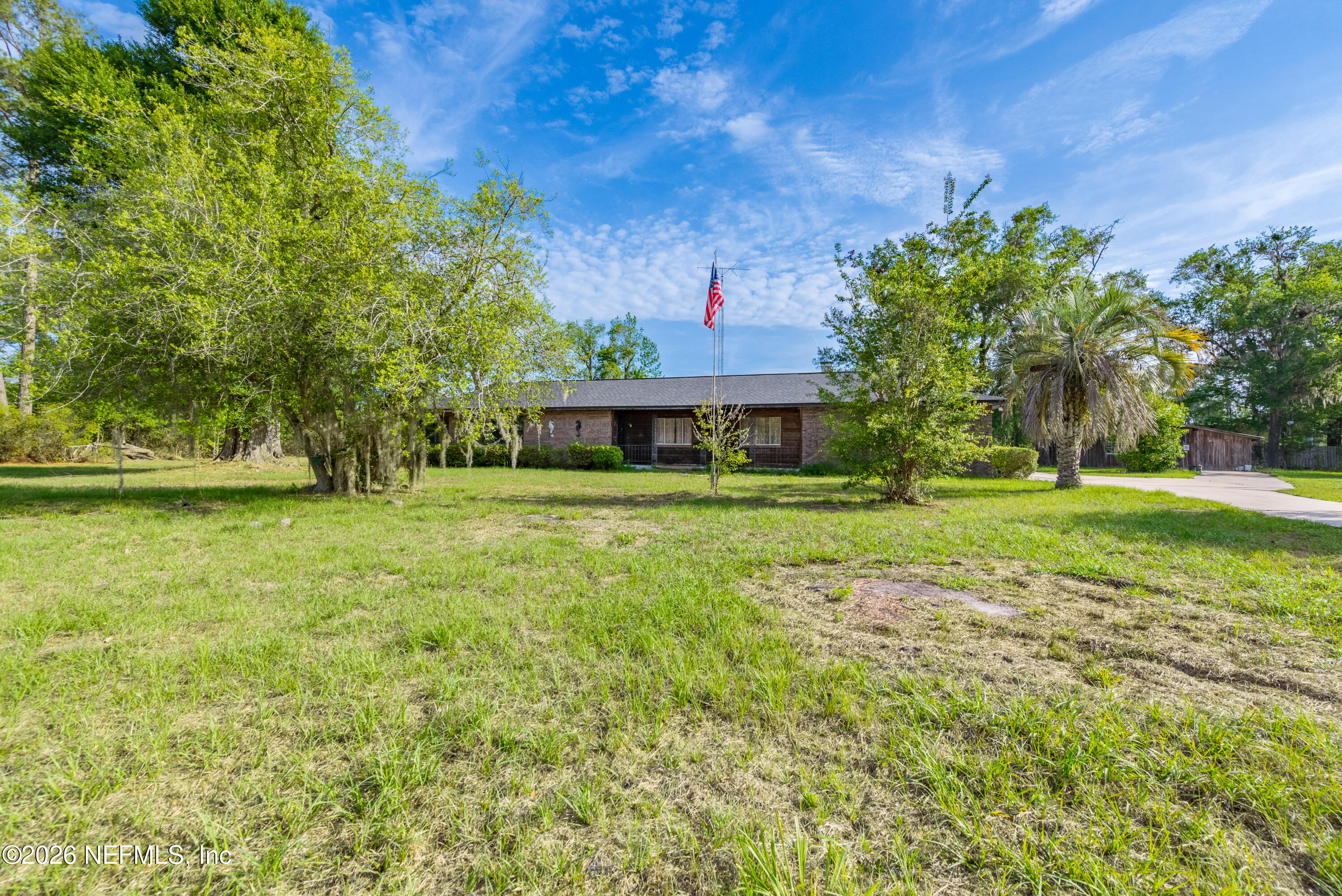 12781 Highway 100 Lake Butler, FL 32054 - Photo 4 of 100 a front view of a house with a yard
