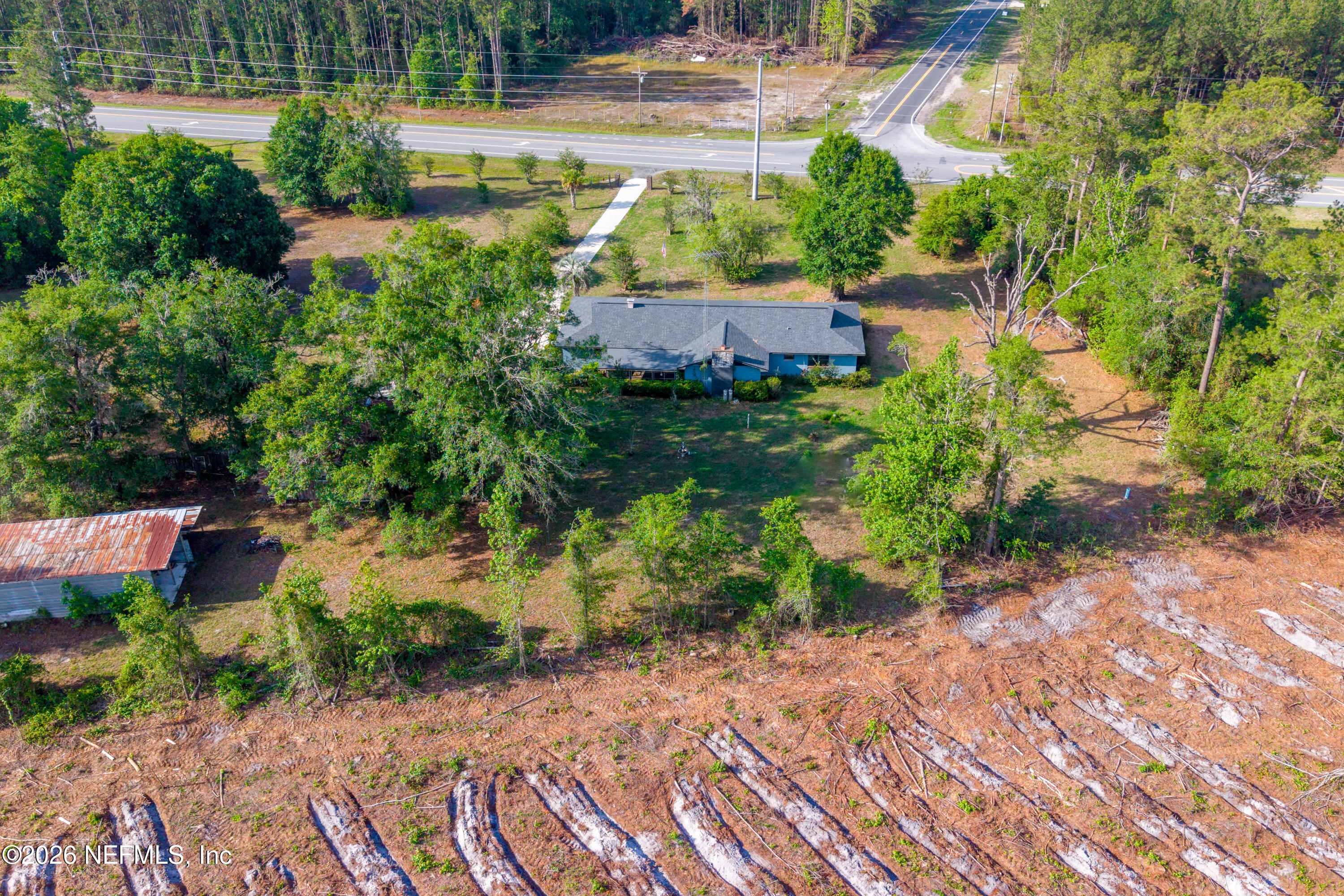 12781 Highway 100 Lake Butler, FL 32054 - Photo 42 of 100 a view of a yard with plants and large trees