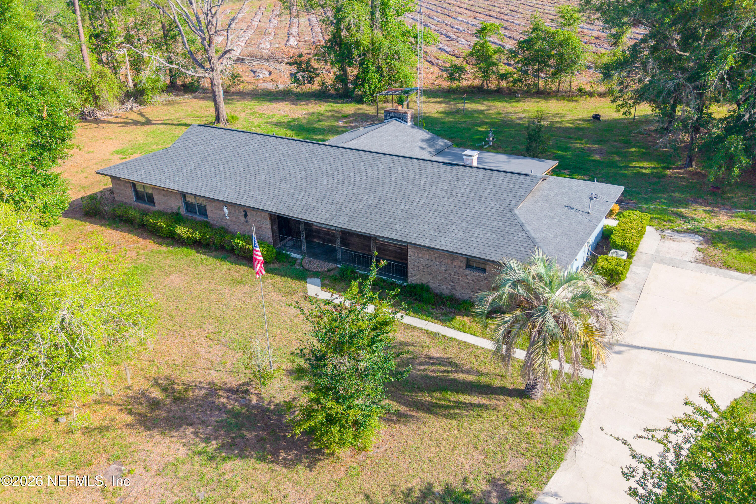 12781 Highway 100 Lake Butler, FL 32054 - Photo 46 of 100 an aerial view of a house with garden space and a patio