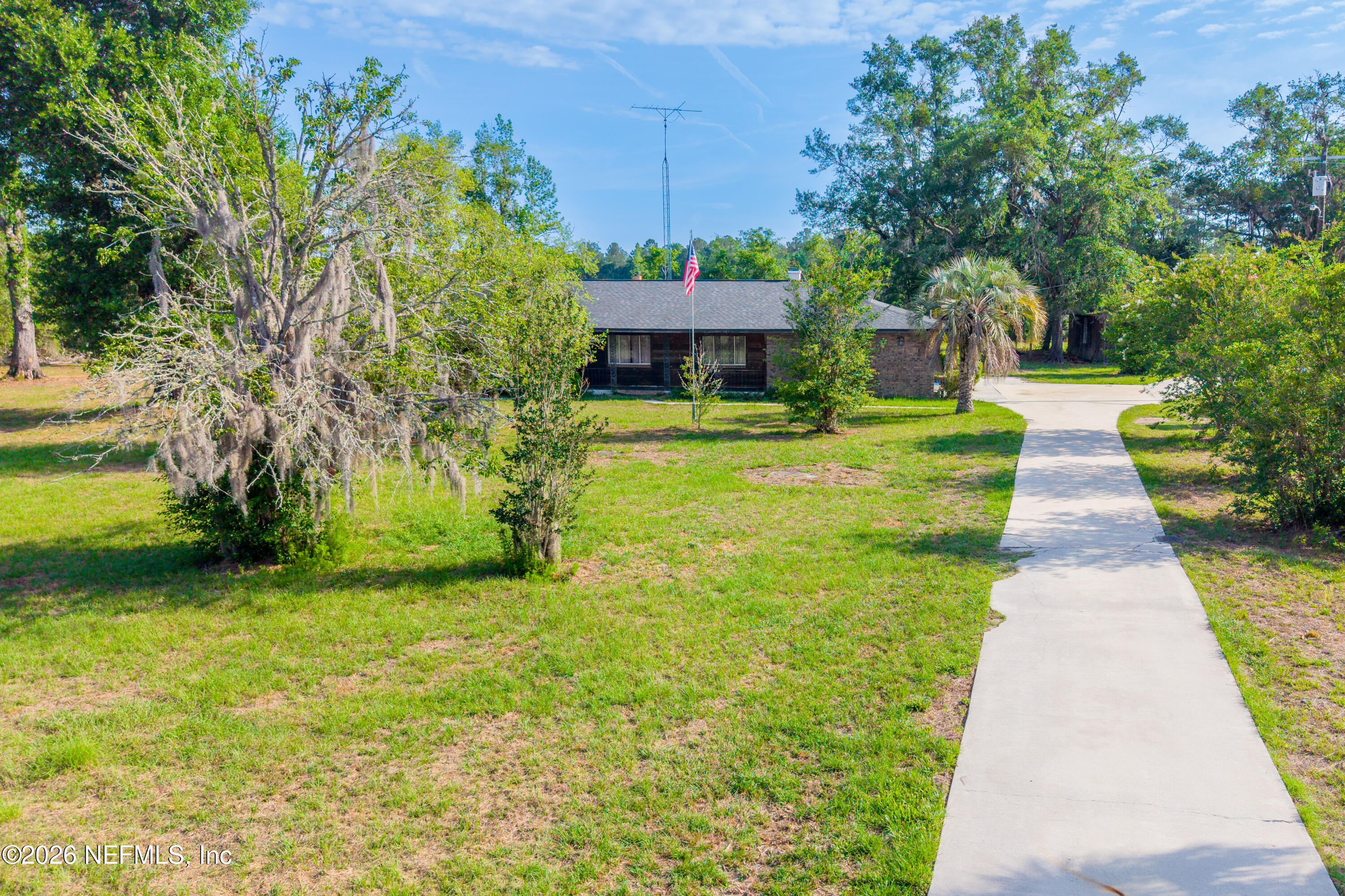 12781 Highway 100 Lake Butler, FL 32054 - Photo 47 of 100 a front view of a house with a yard
