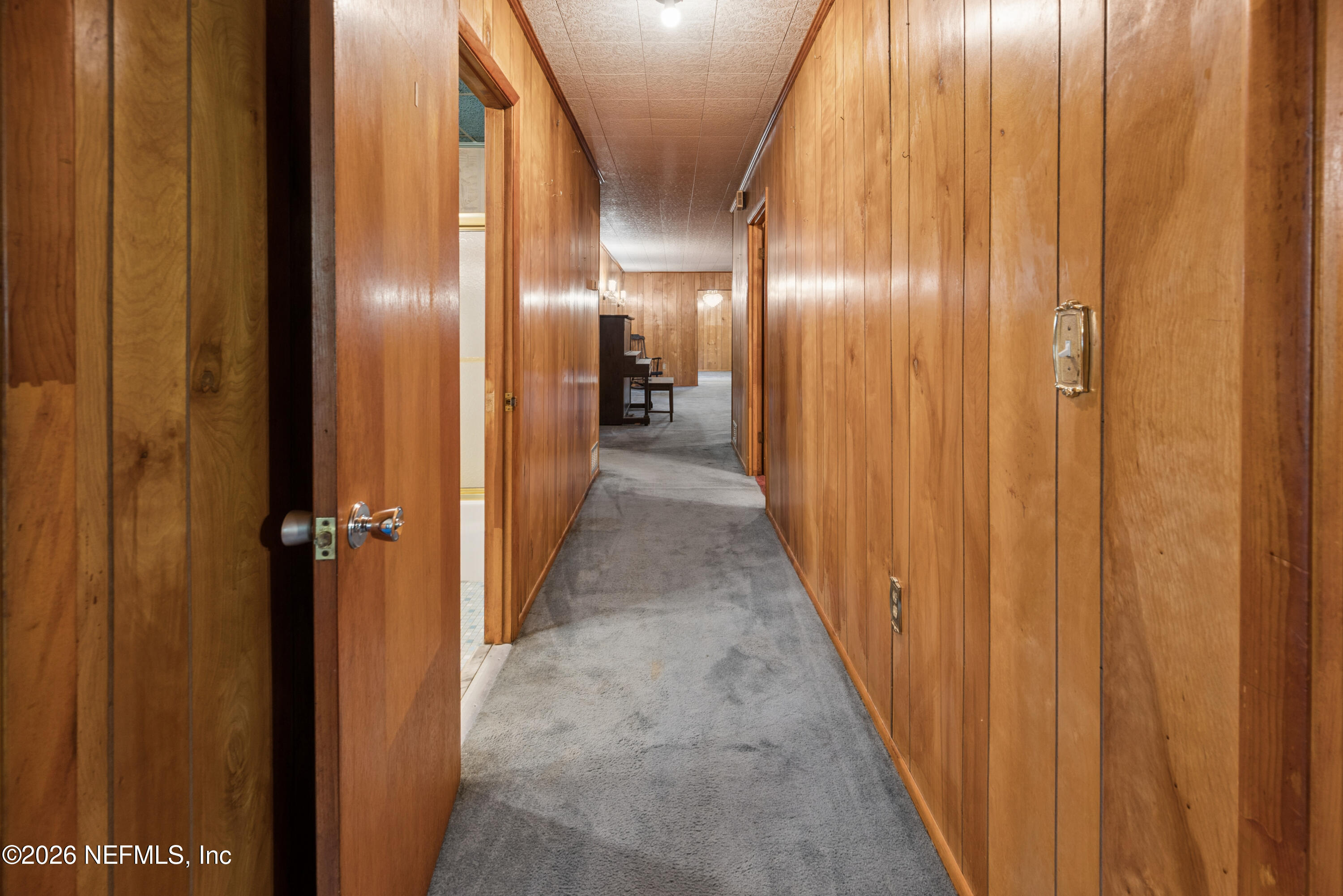 12781 Highway 100 Lake Butler, FL 32054 - Photo 56 of 100 a view of a hallway with wooden floor
