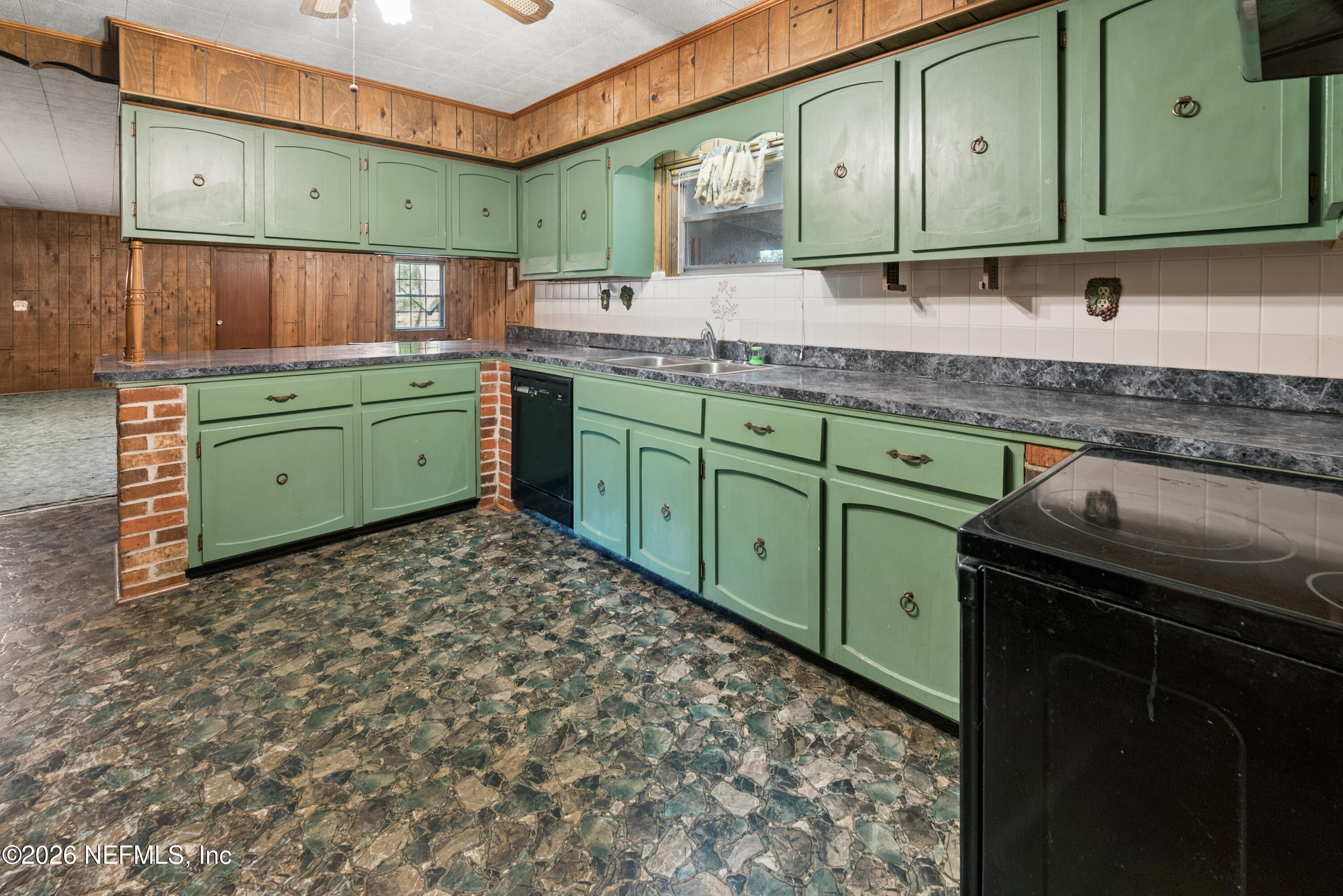 12781 Highway 100 Lake Butler, FL 32054 - Photo 65 of 100 a kitchen with sink and cabinets