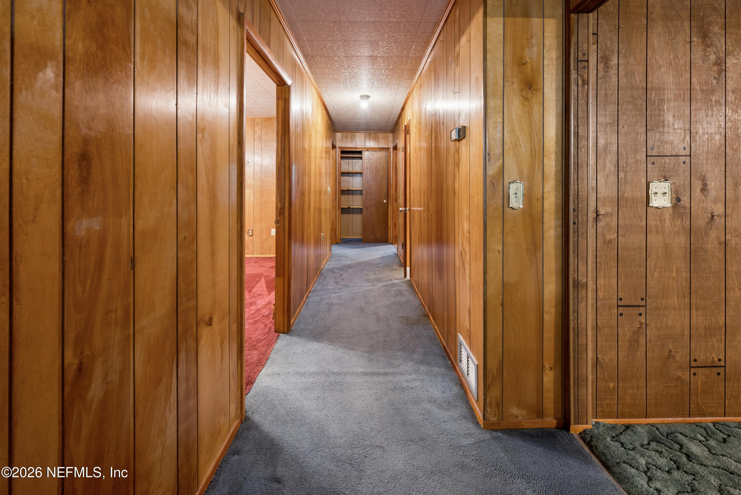 12781 Highway 100 Lake Butler, FL 32054 - Photo 84 of 100 a view of a hallway with wooden floor