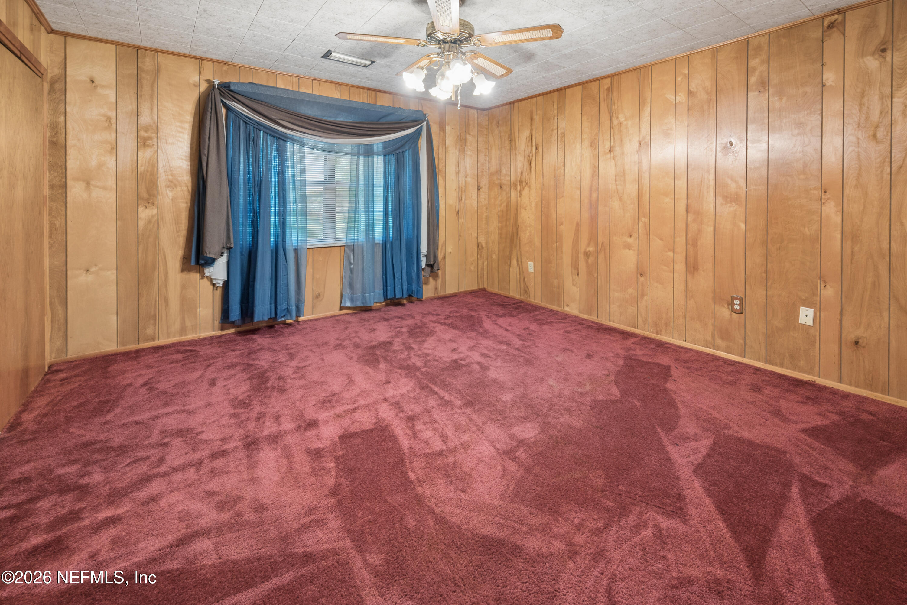 12781 Highway 100 Lake Butler, FL 32054 - Photo 85 of 100 a view of a big room with a chandelier fan and windows