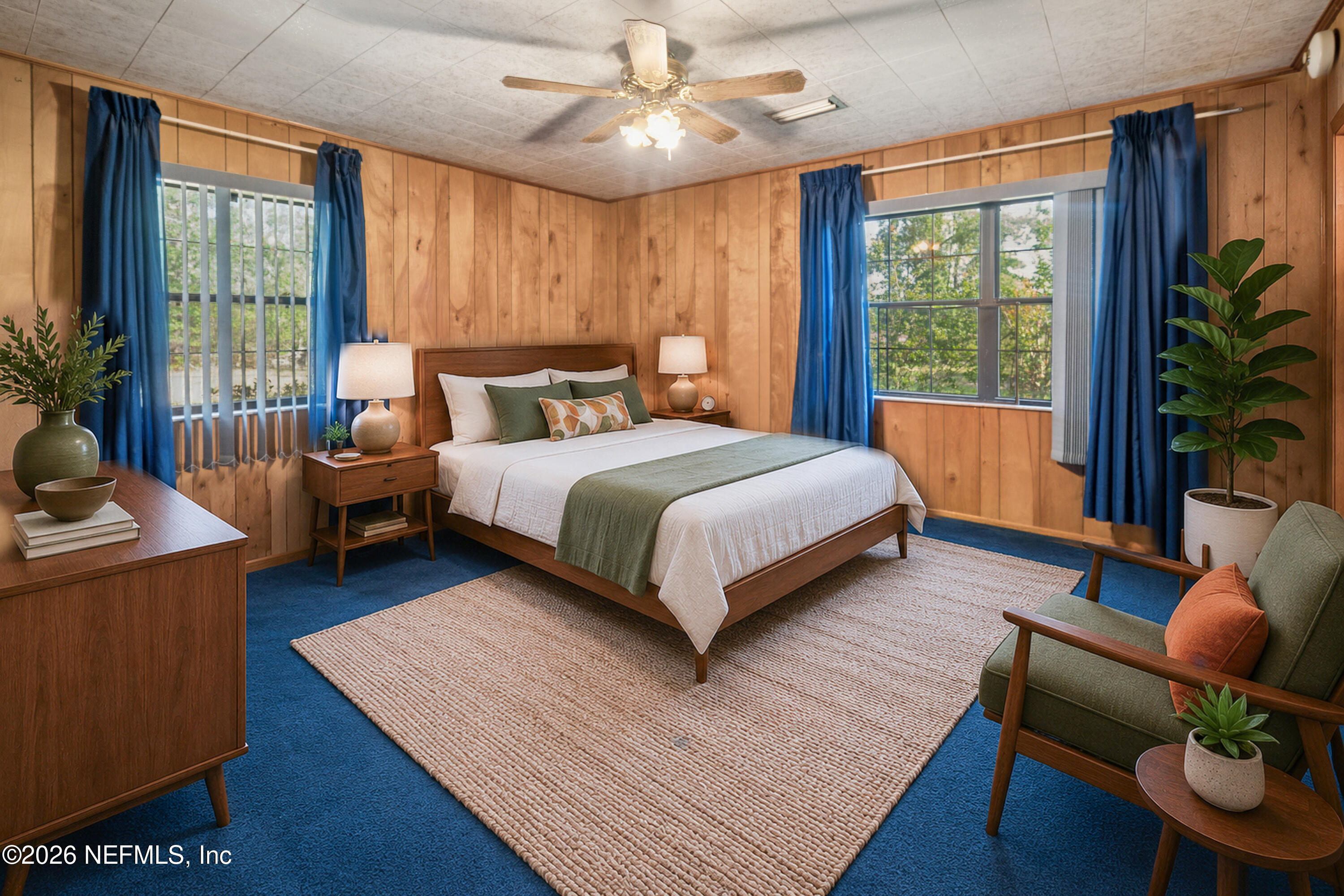 12781 Highway 100 Lake Butler, FL 32054 - Photo 94 of 100 a bedroom with a bed a couch and a large window