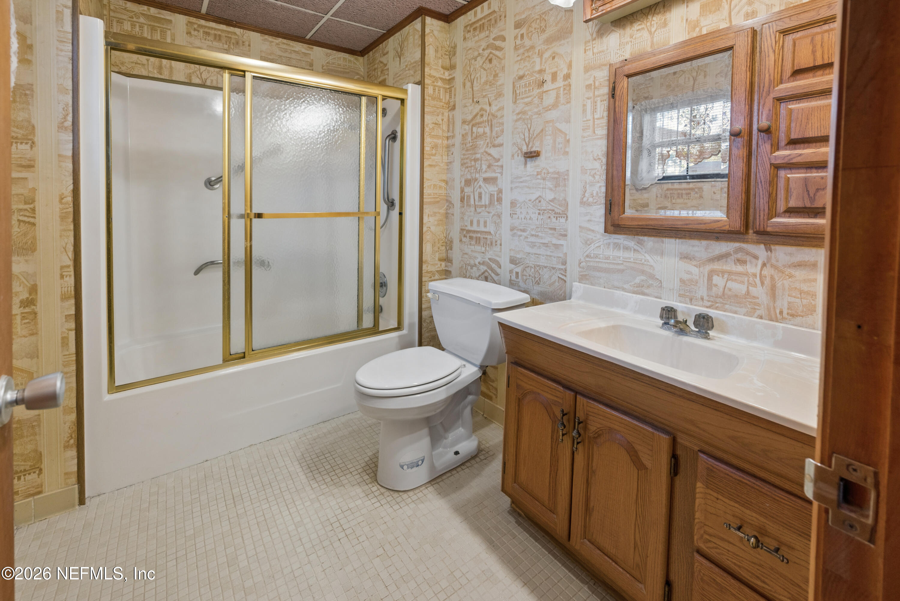 12781 Highway 100 Lake Butler, FL 32054 - Photo 98 of 100 a bathroom with a sink mirror vanity and toilet