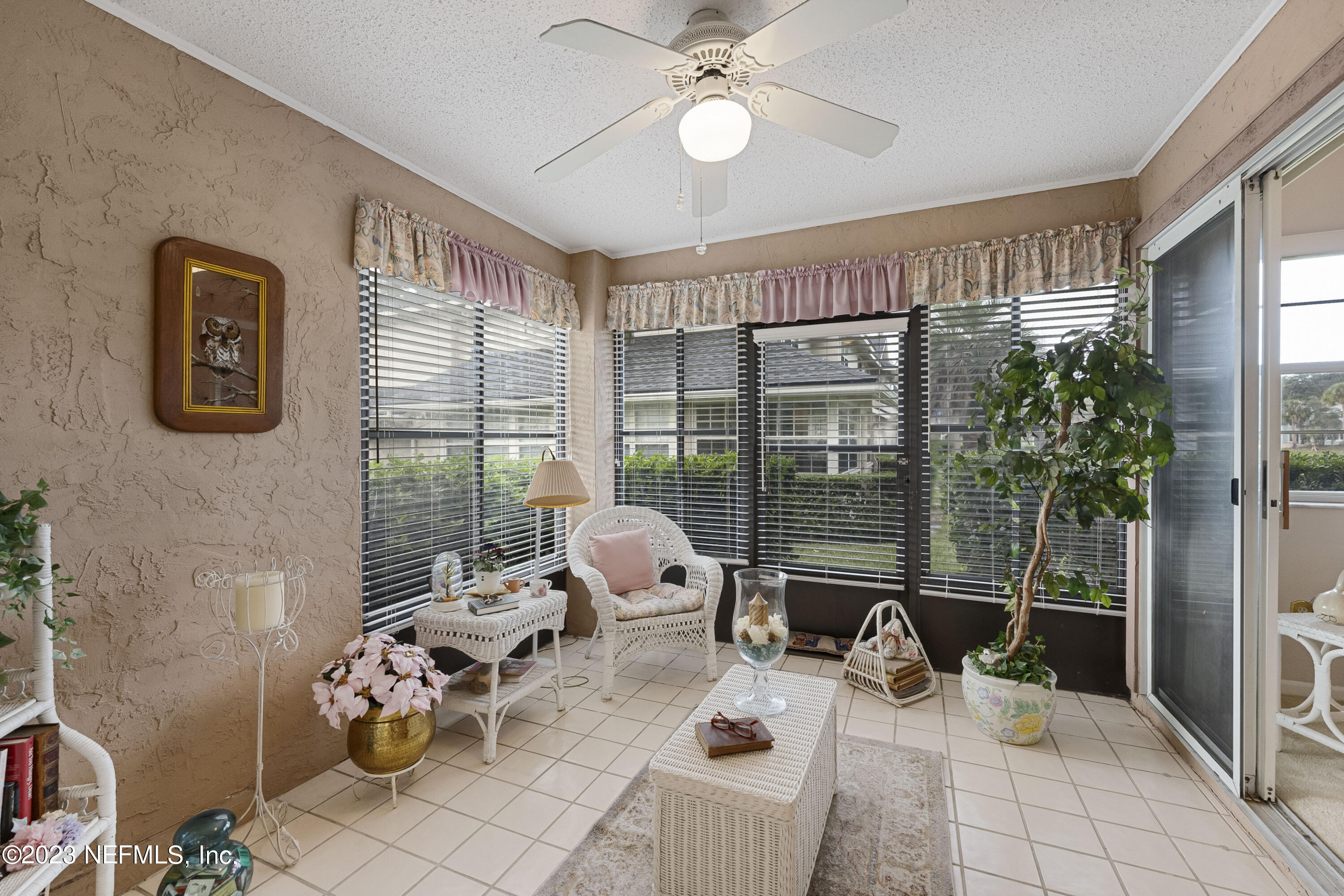 601 Tournament Road Ponte Vedra Beach, FL 32082 - Photo 17 of 31 a living room with furniture and a large window with garden view