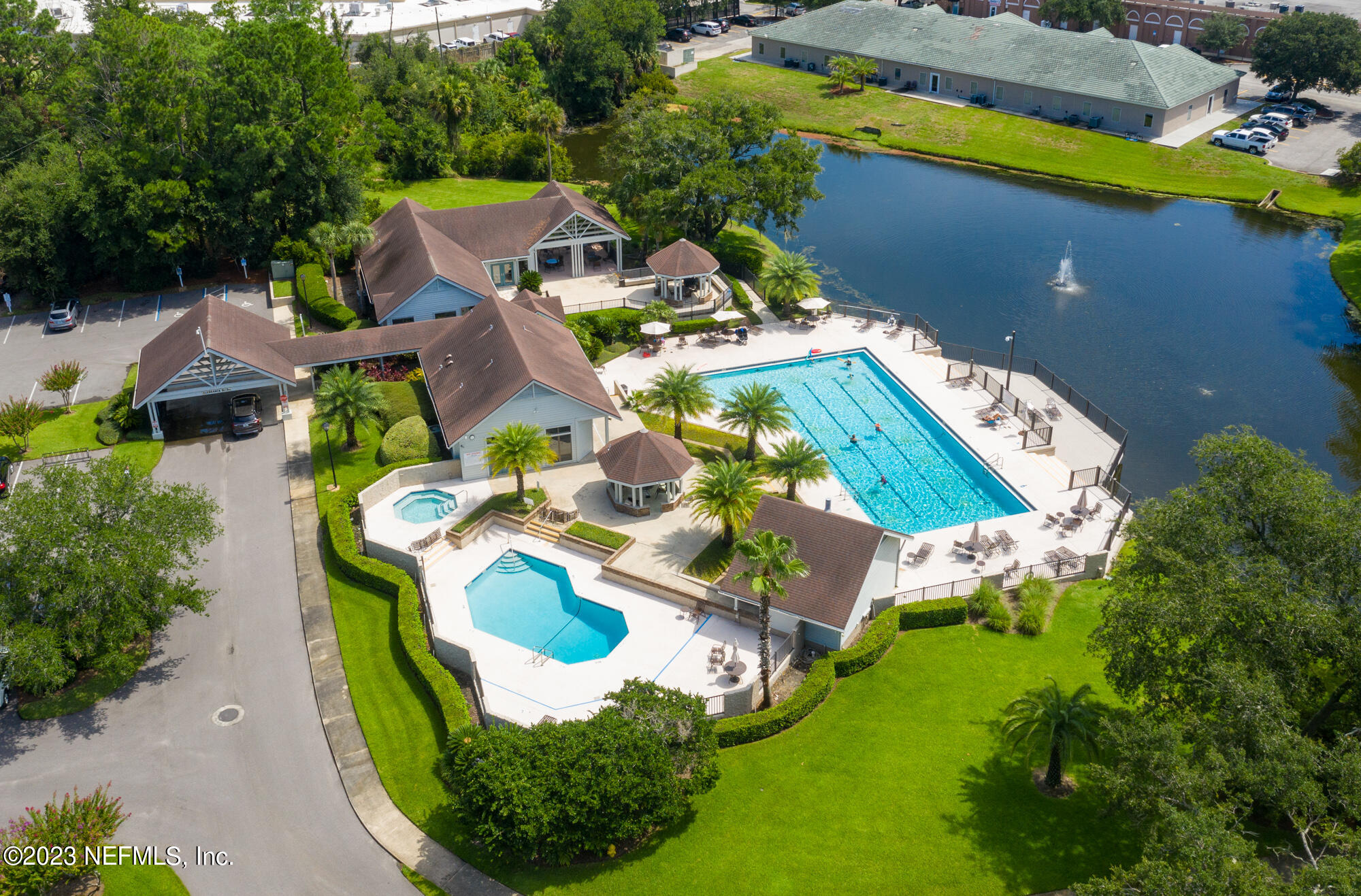 601 Tournament Road Ponte Vedra Beach, FL 32082 - Photo 27 of 31 an aerial view of a house with a garden and swimming pool