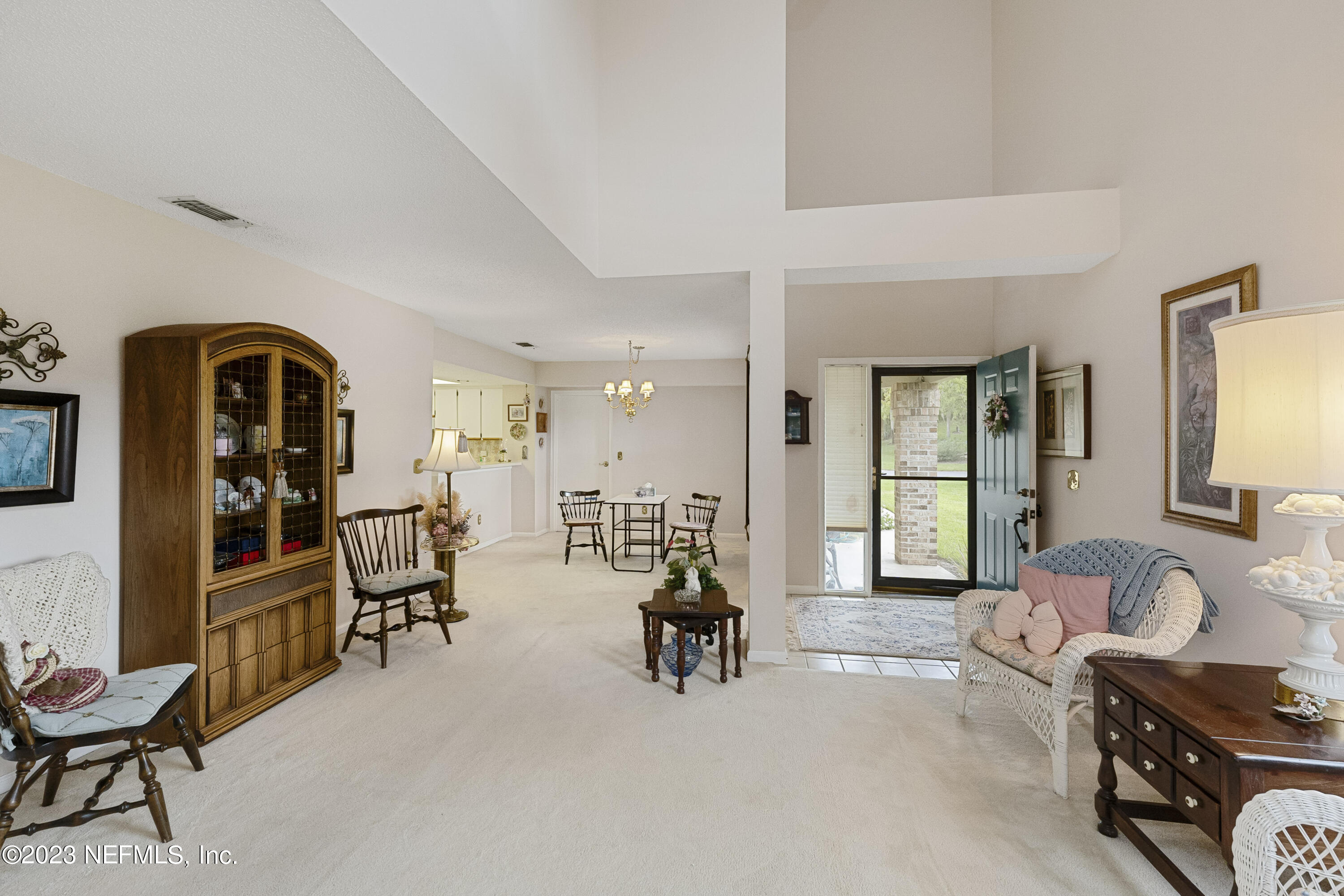 601 Tournament Road Ponte Vedra Beach, FL 32082 - Photo 3 of 31 a living room with furniture and a large window