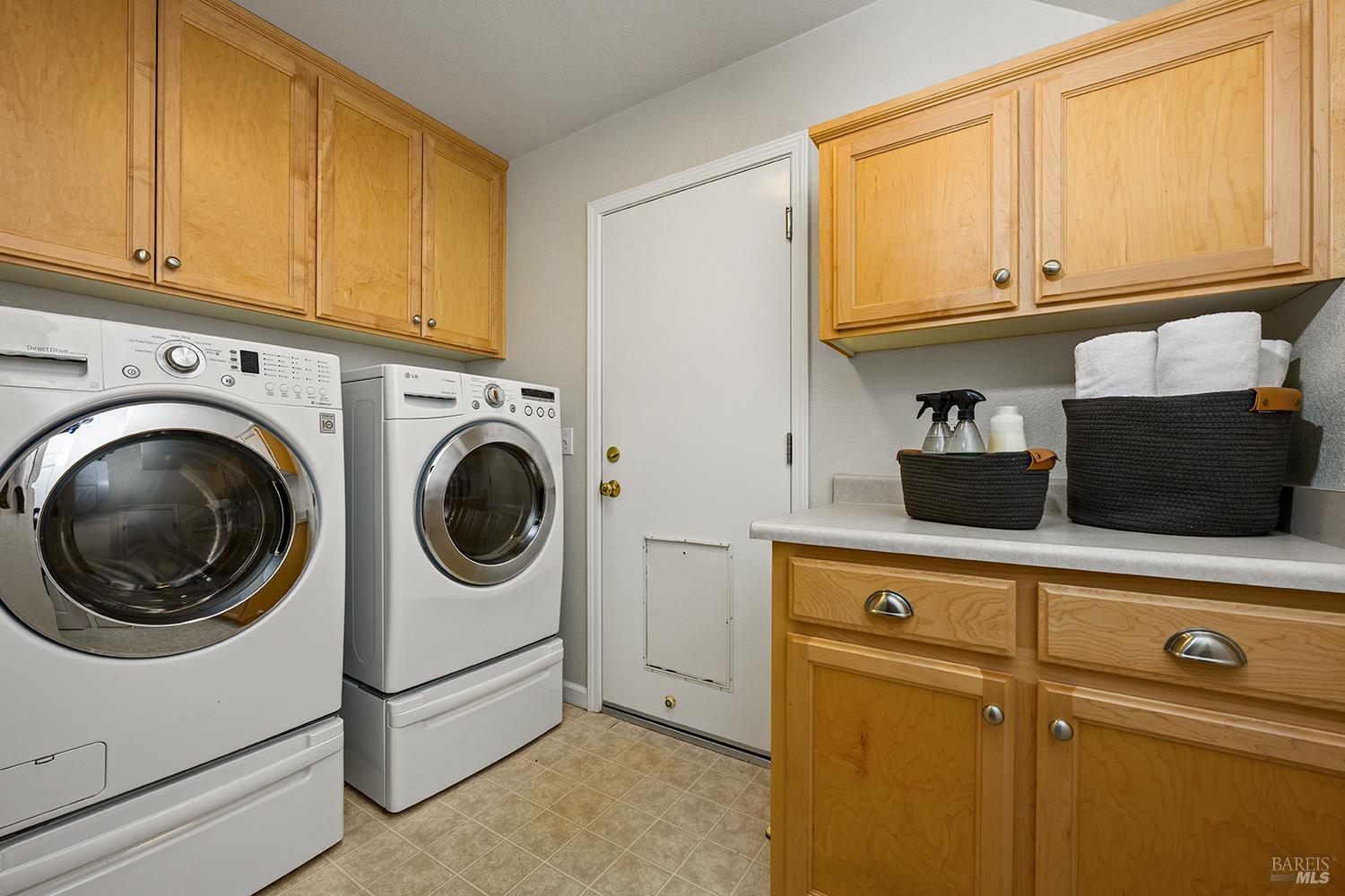 38 Maybeck Street Novato, CA 94949 - Photo 43 of 47 a utility room with sink dryer and washer
