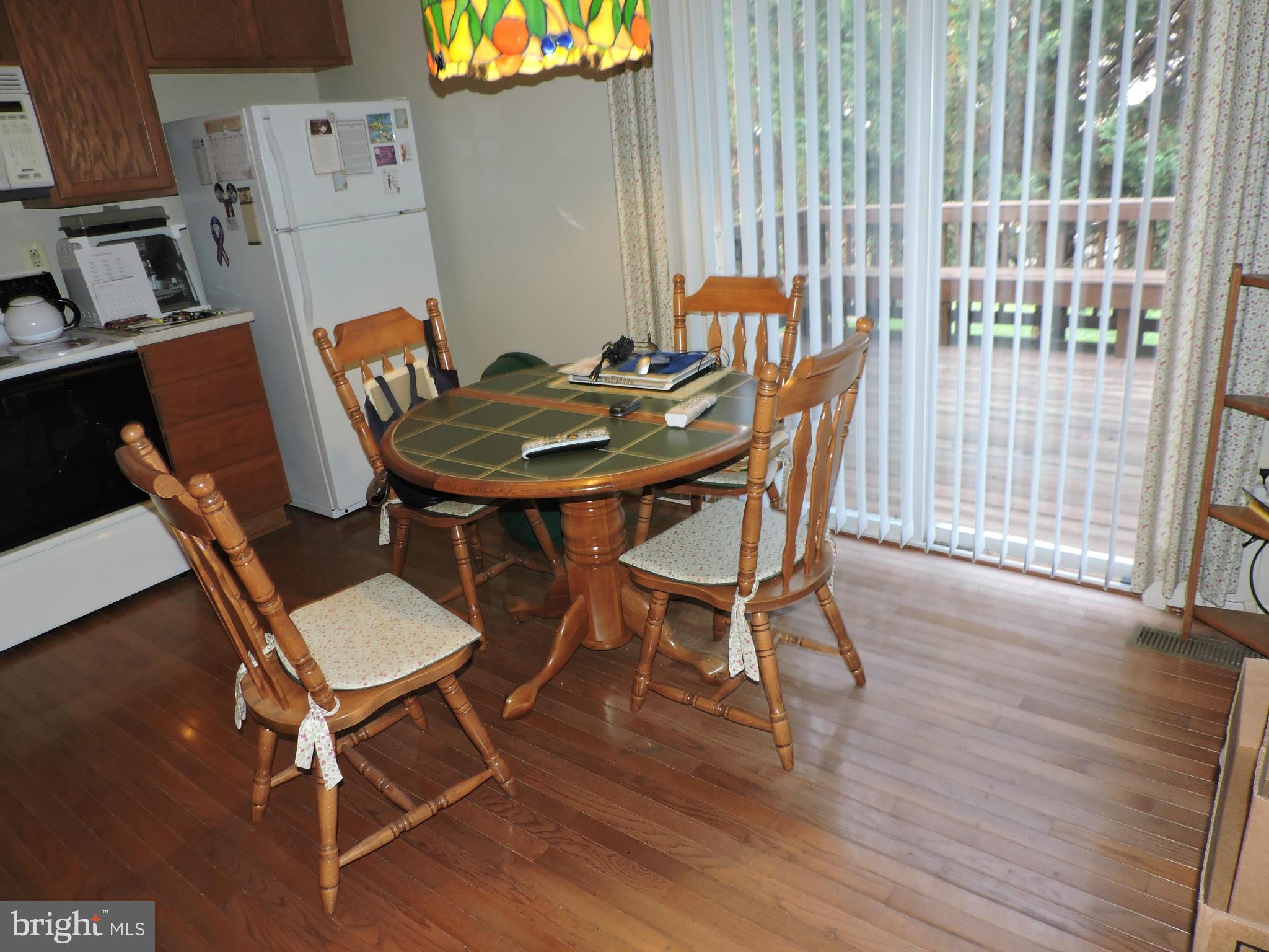 41 Morton Ridge Warrenton, VA 20186 - Photo 4 of 14 a view of a dining room with furniture and wooden floor