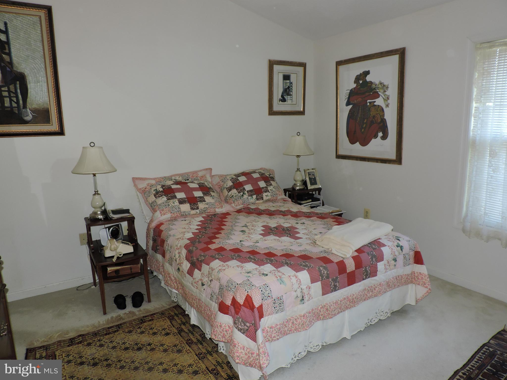41 Morton Ridge Warrenton, VA 20186 - Photo 5 of 14 a bedroom with a bed and a lamp on dresser