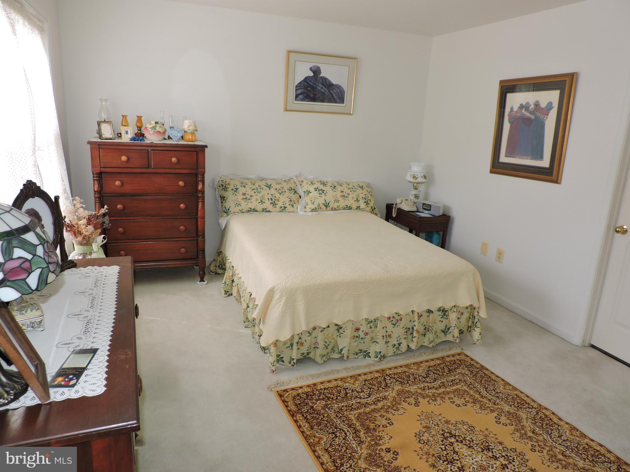 41 Morton Ridge Warrenton, VA 20186 - Photo 6 of 14 a bedroom with a bed and a dresser