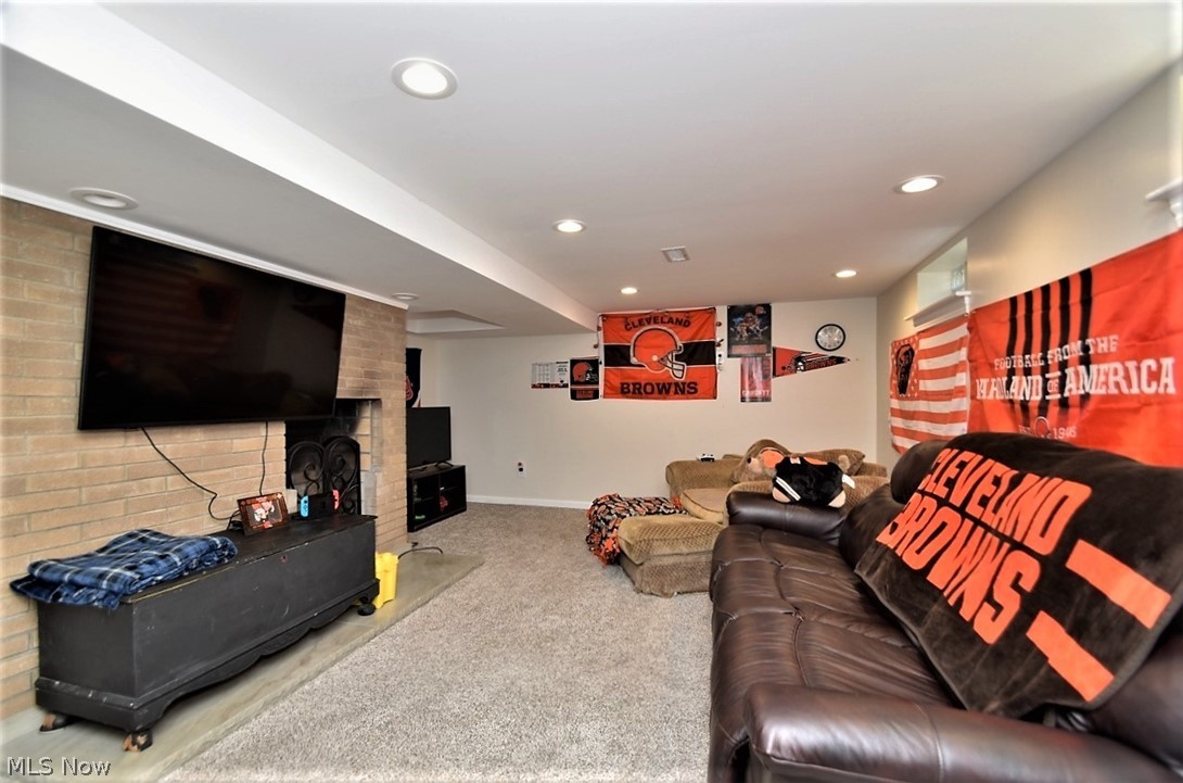 8790 Avery Road Broadview Heights, OH 44147 - Photo 25 of 35 The finished rec room on the lower level is perfect for watching the game or playing video games.