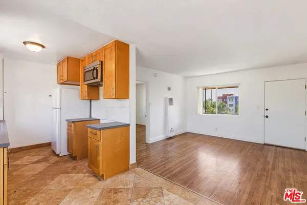 a view of a storage & utility room with wooden floor