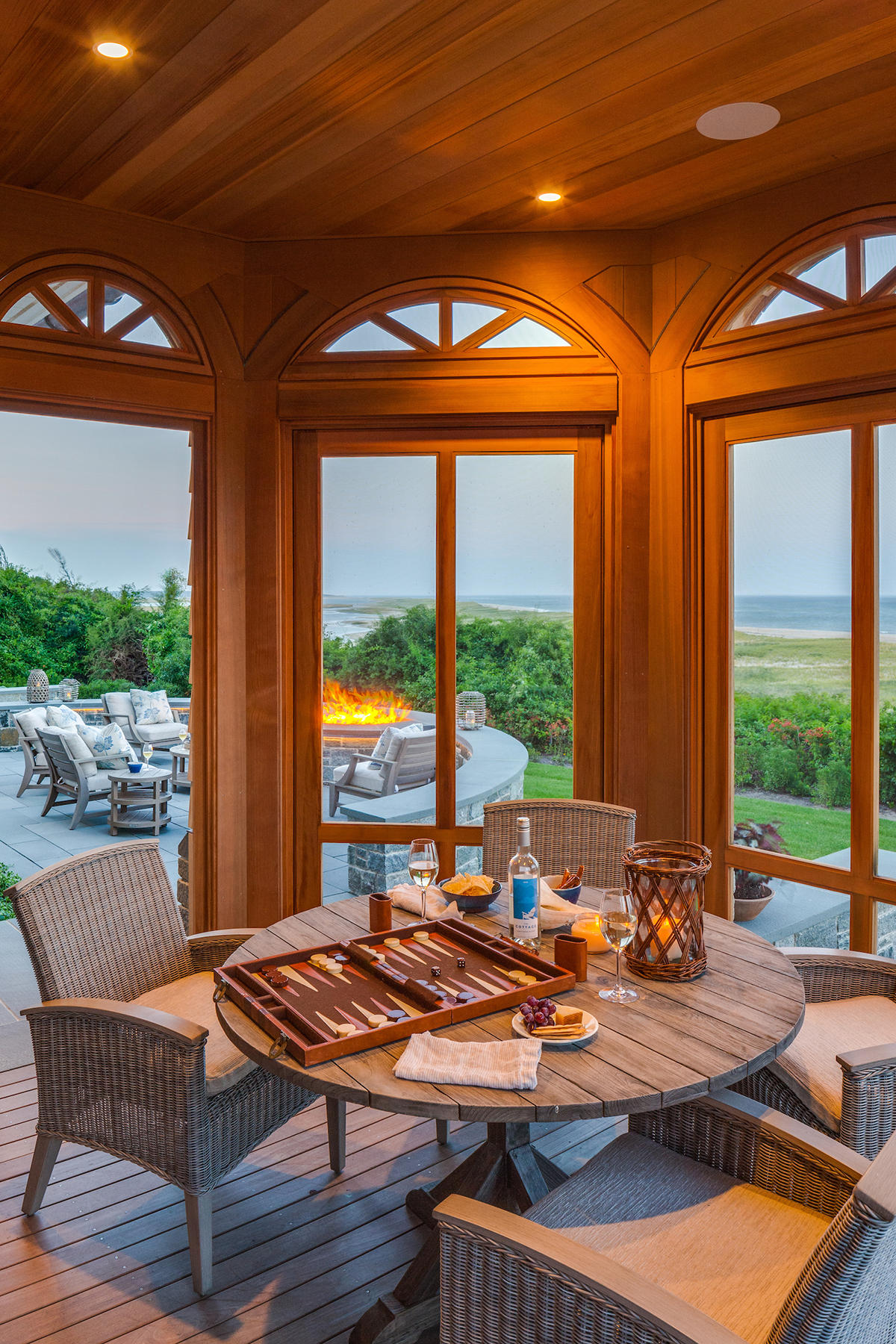 51 Nauset Road Orleans, MA 02653 - Photo 11 of 33 a view of a patio with a dining table and chairs