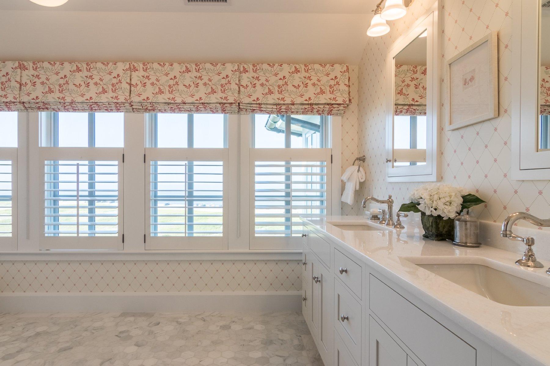 51 Nauset Road Orleans, MA 02653 - Photo 14 of 33 a bathroom with a sink and a window