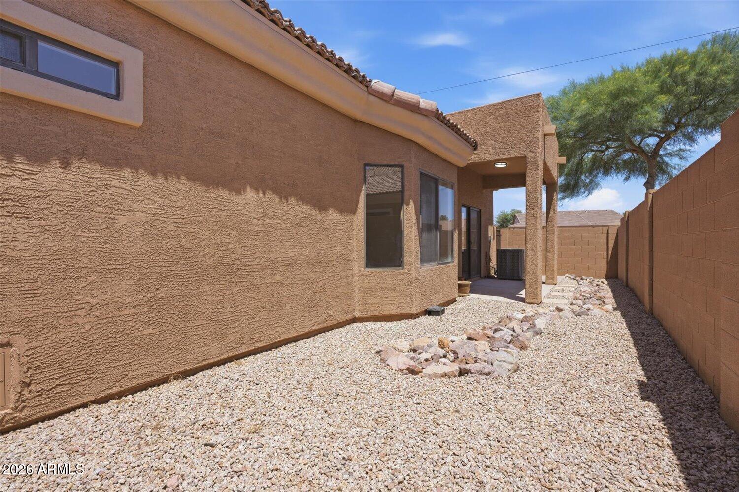 2565 South Signal Butte Road, Unit 23 Mesa, AZ 85209 - Photo 25 of 29 a view of a backyard of the house