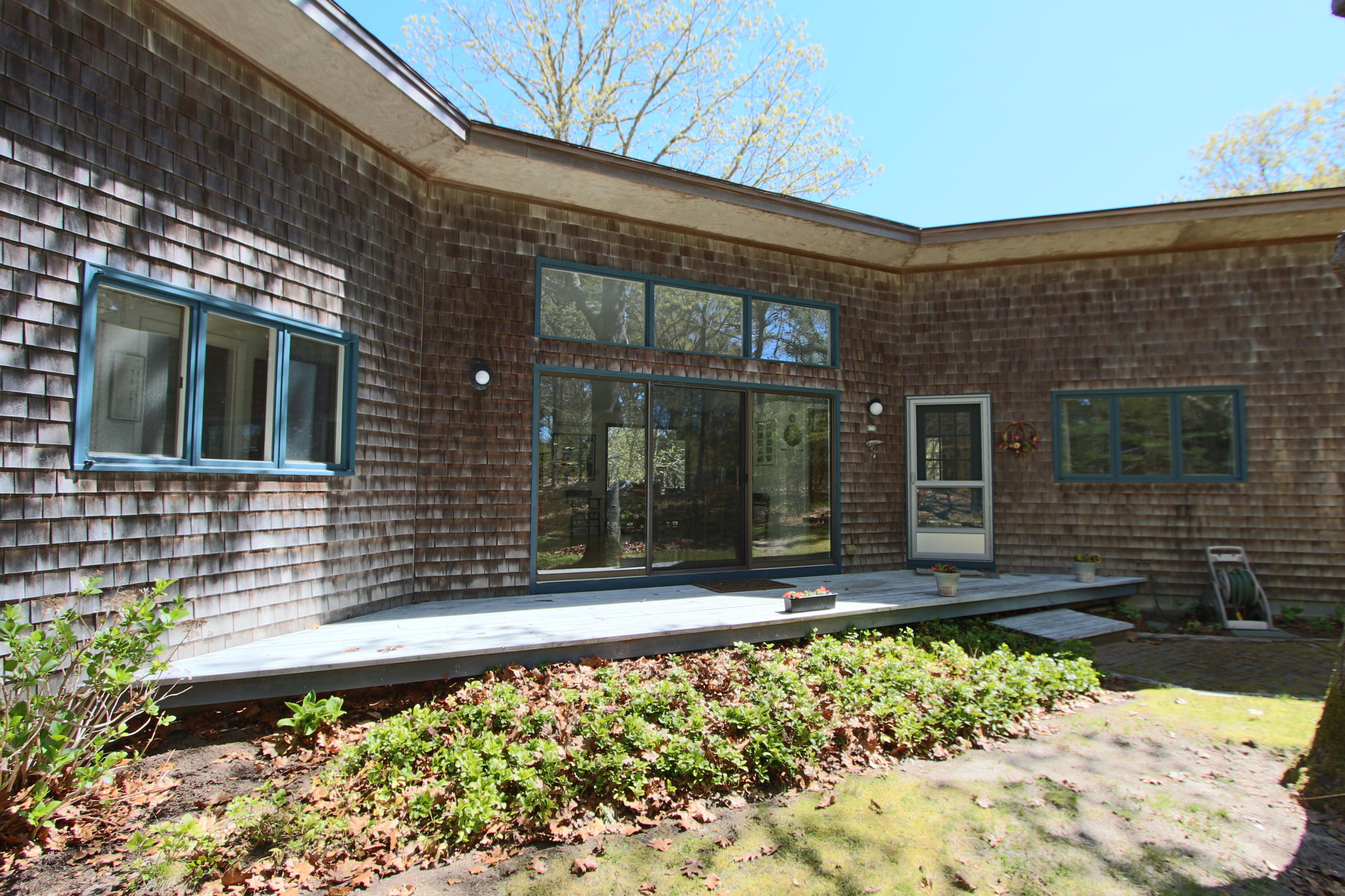 a front view of a house with a large window