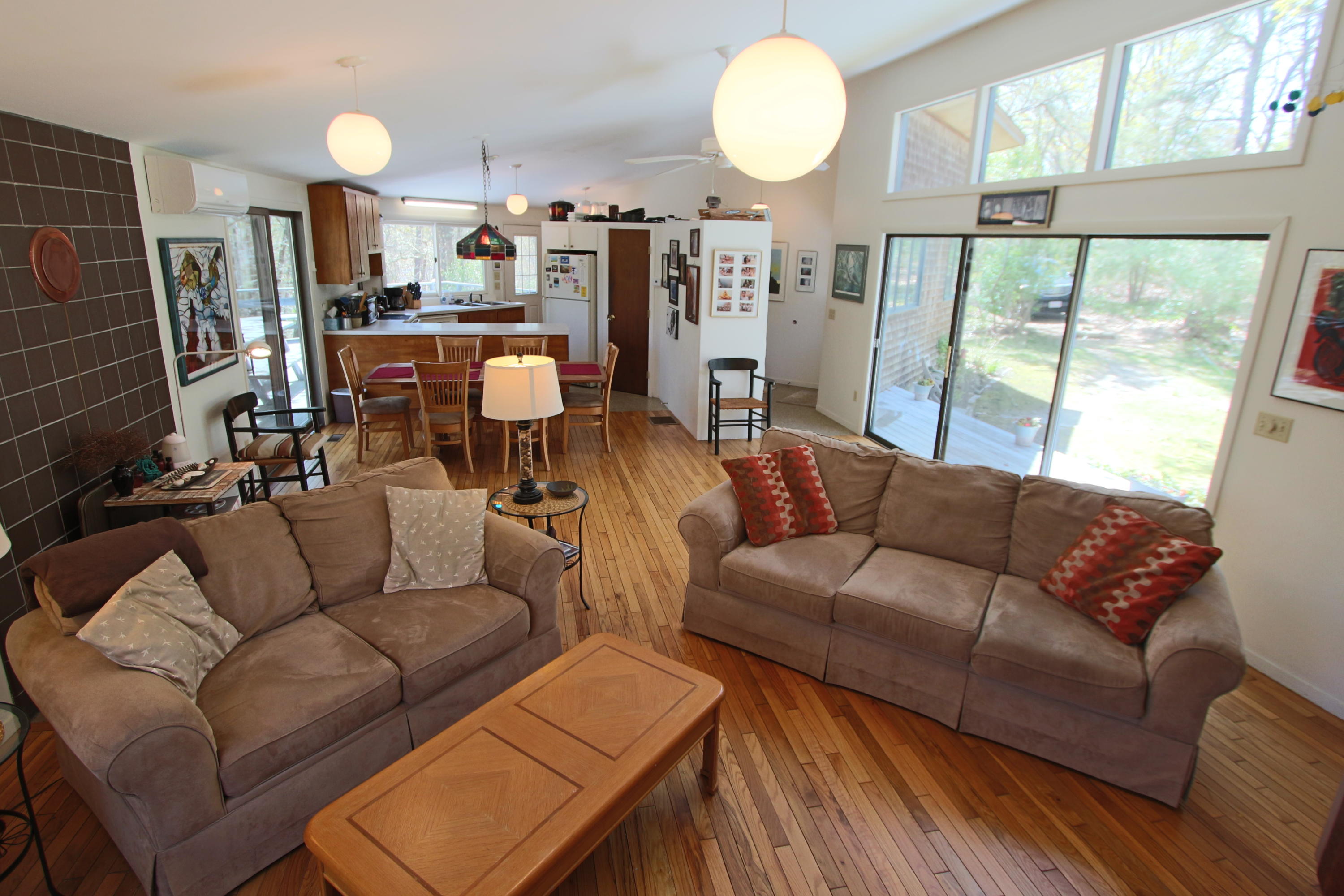 5 4th Of July Road Truro, MA 02666 - Photo 11 of 33 a living room with furniture kitchen view and a large window