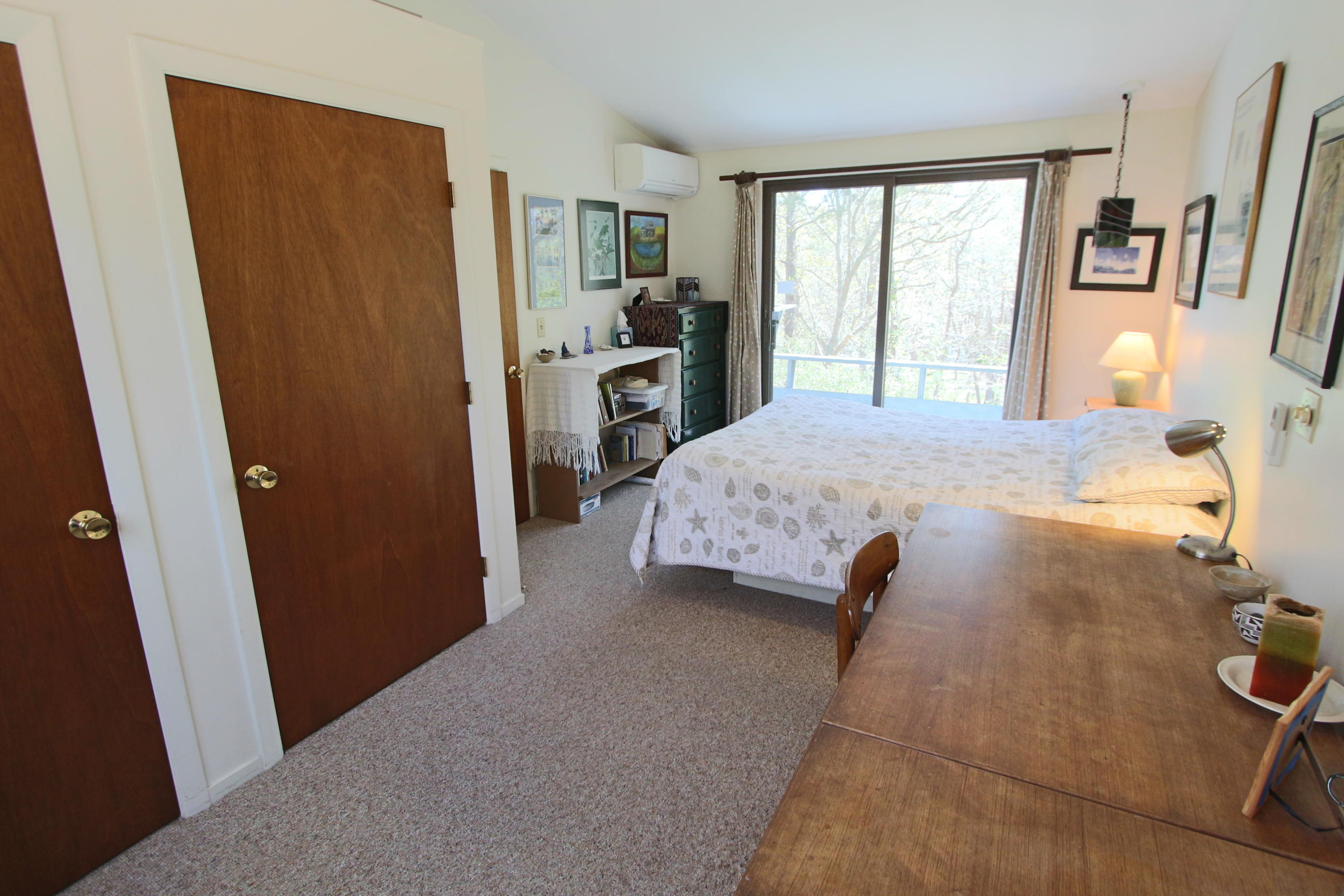 5 4th Of July Road Truro, MA 02666 - Photo 12 of 33 a bed room with a bed and a window