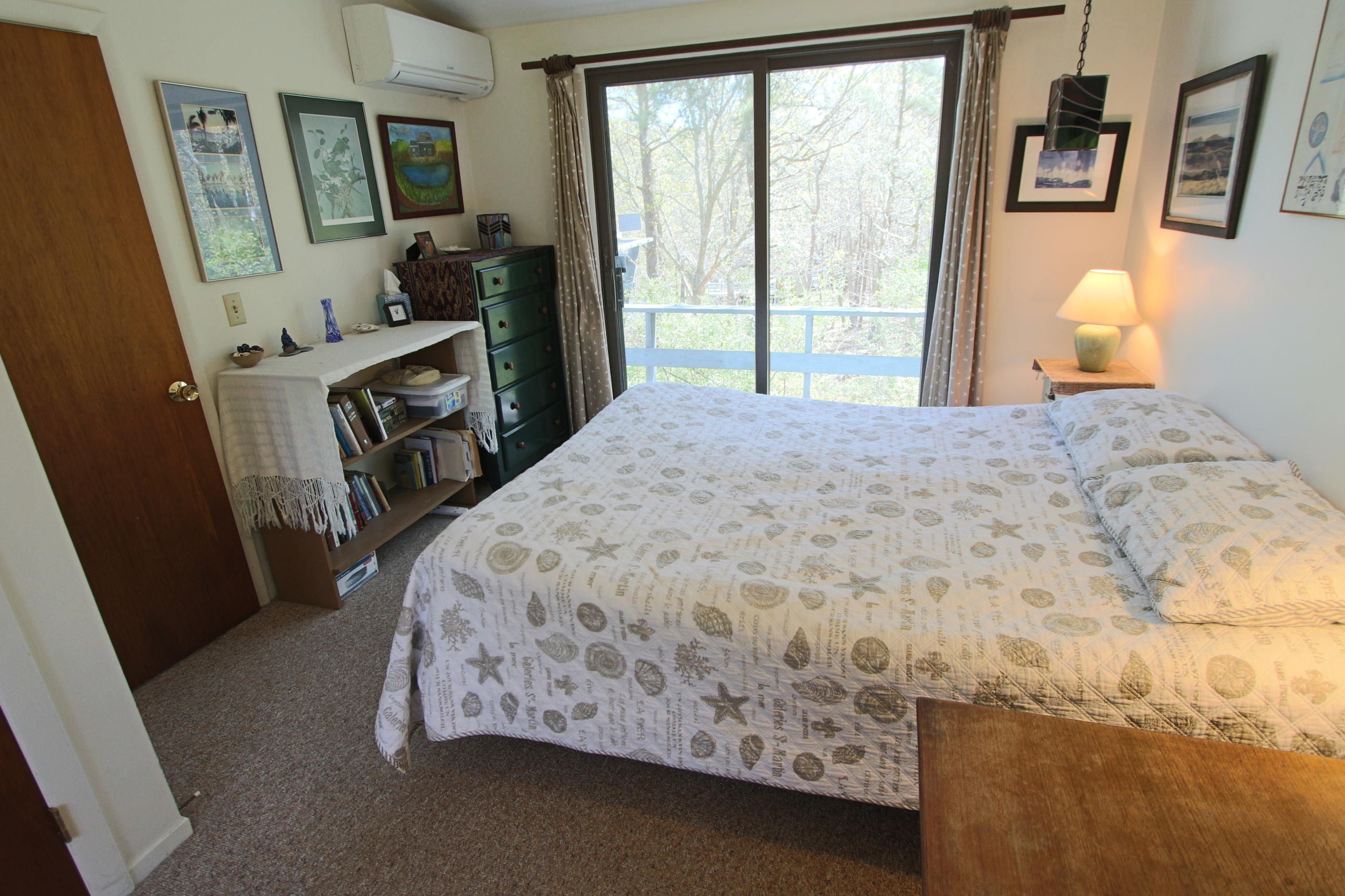5 4th Of July Road Truro, MA 02666 - Photo 14 of 33 a bed sitting in a bedroom next to a window
