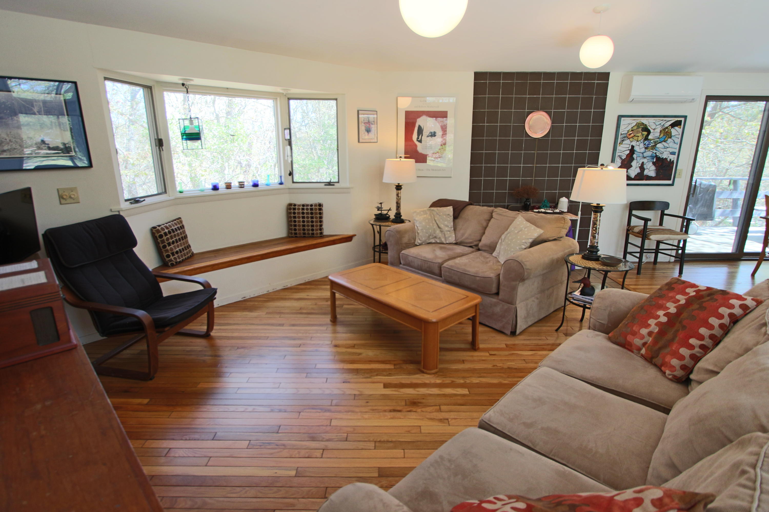 5 4th Of July Road Truro, MA 02666 - Photo 3 of 33 a living room with furniture and a flat screen tv