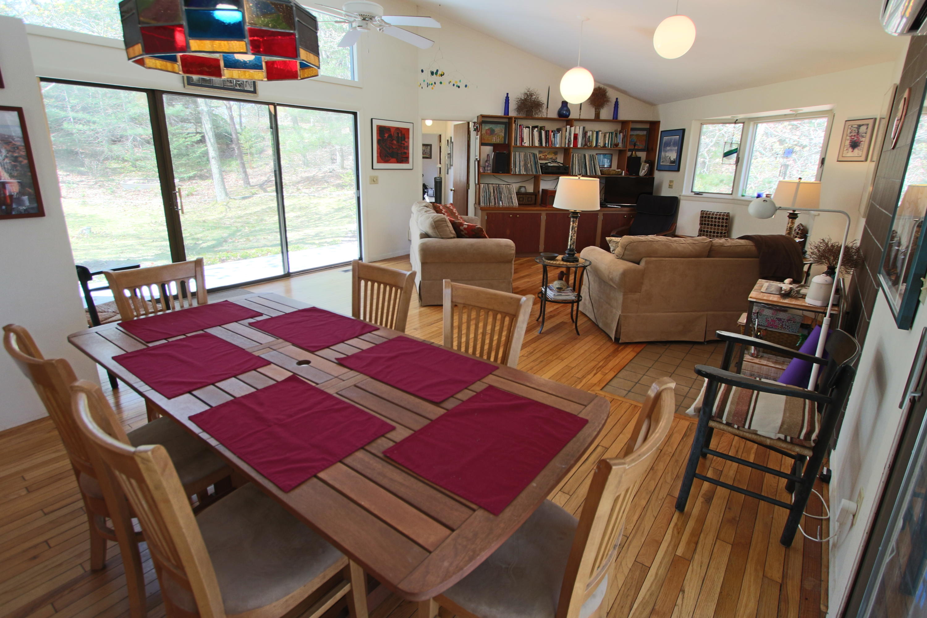 5 4th Of July Road Truro, MA 02666 - Photo 7 of 33 a view of a dining room with furniture a rug and wooden floor