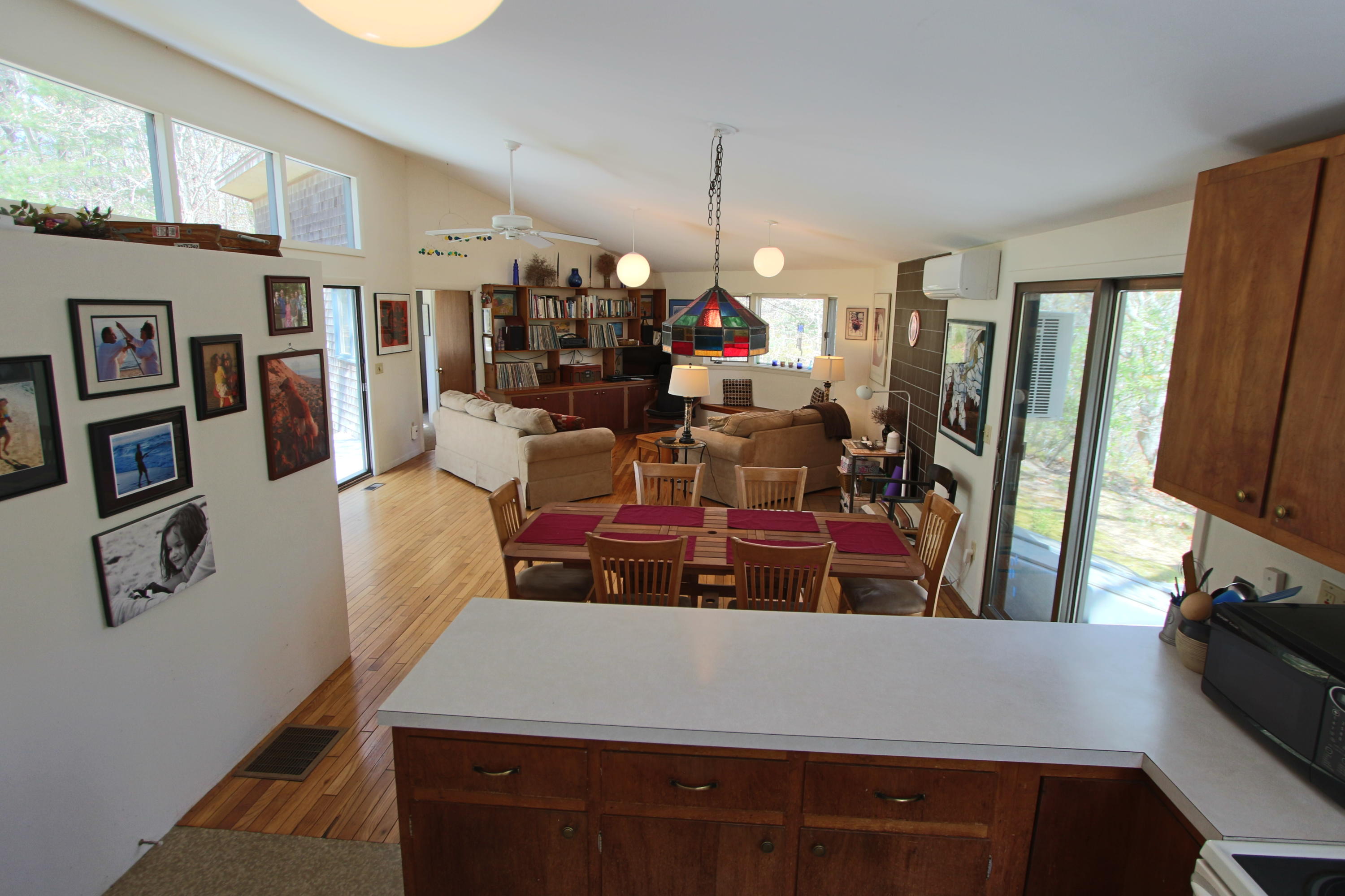 5 4th Of July Road Truro, MA 02666 - Photo 10 of 33 a view of a dining room with furniture window and wooden floor