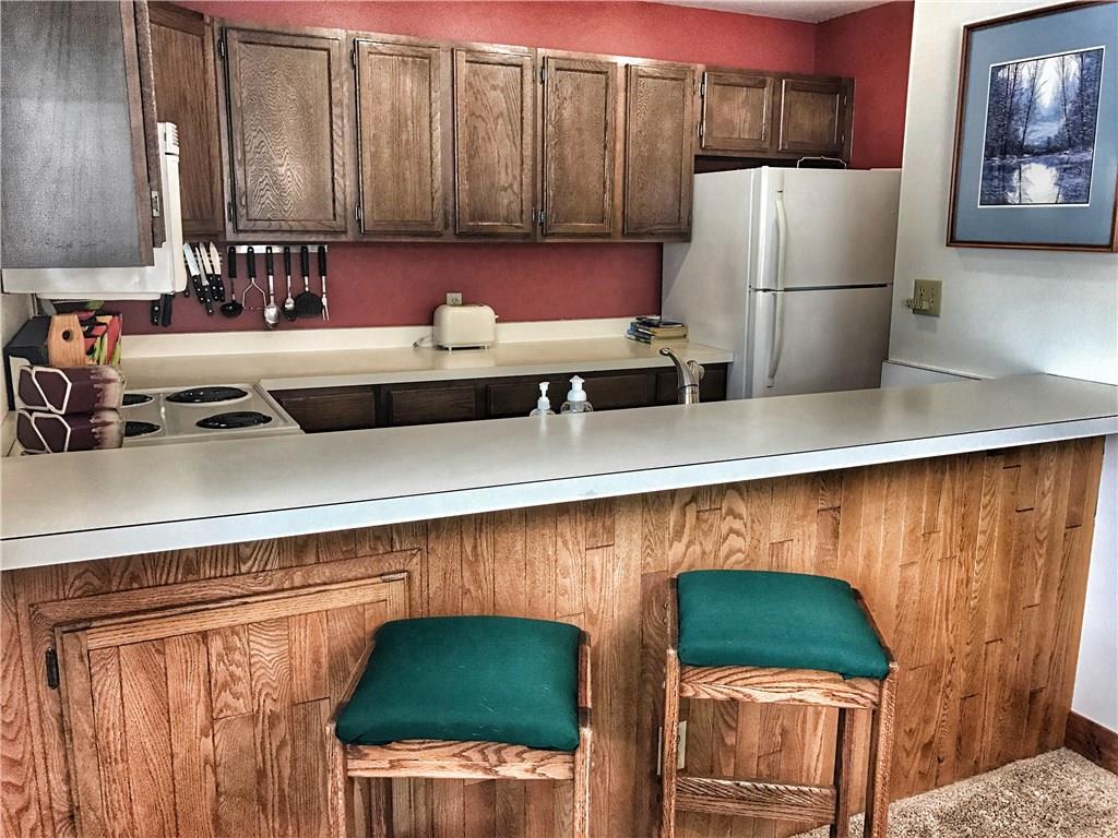 1977 Soda Ridge Road, Unit 1185 Keystone, CO 80435 - Photo 3 of 15 a kitchen with a refrigerator and a sink