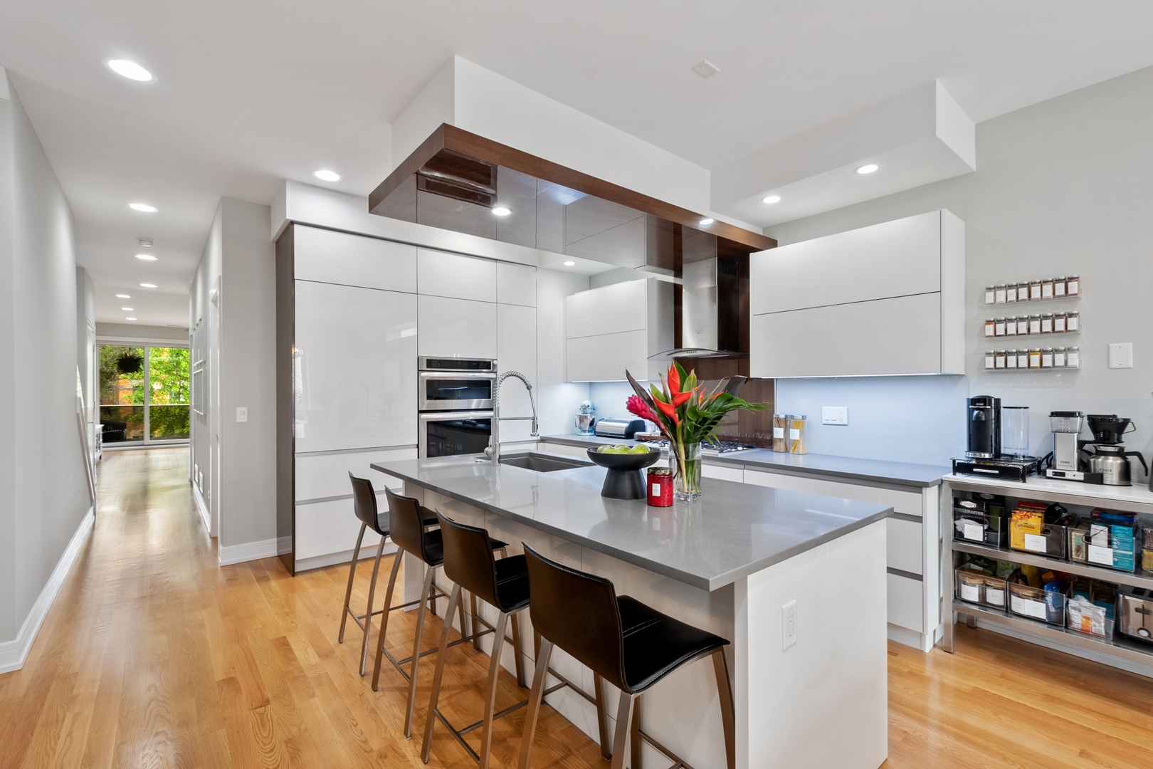 1219 North Cleaver Street, Unit 2 Chicago, IL 60642 - Photo 3 of 23 a kitchen that has a table and chairs in it