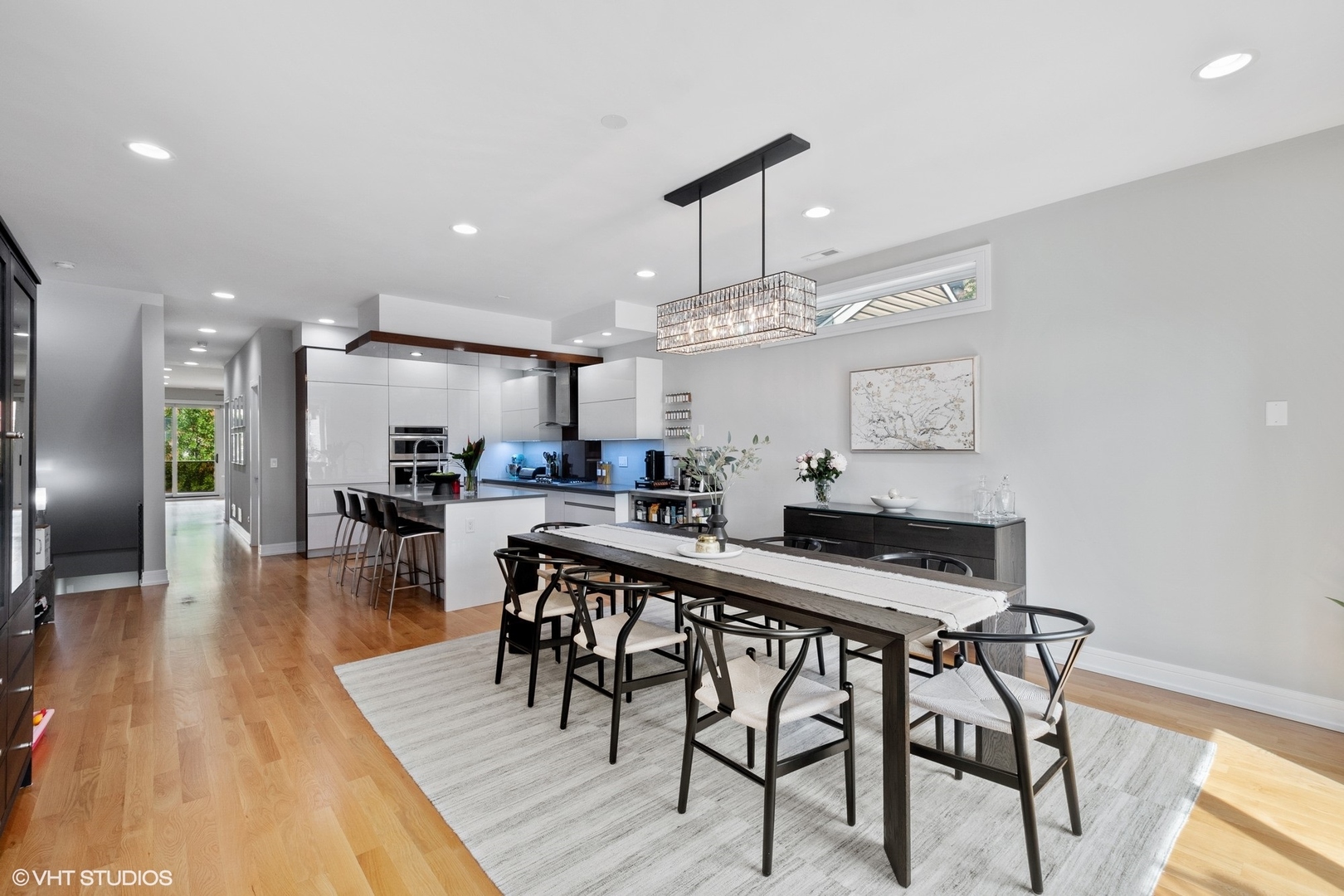 1219 North Cleaver Street, Unit 2 Chicago, IL 60642 - Photo 5 of 23 a view of a dining room with furniture and wooden floor