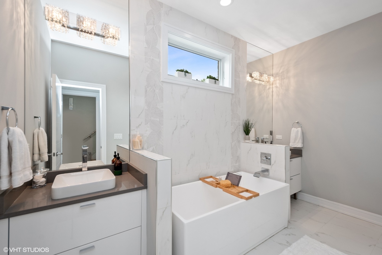 1219 North Cleaver Street, Unit 2 Chicago, IL 60642 - Photo 7 of 23 a bathroom with a sink and a mirror