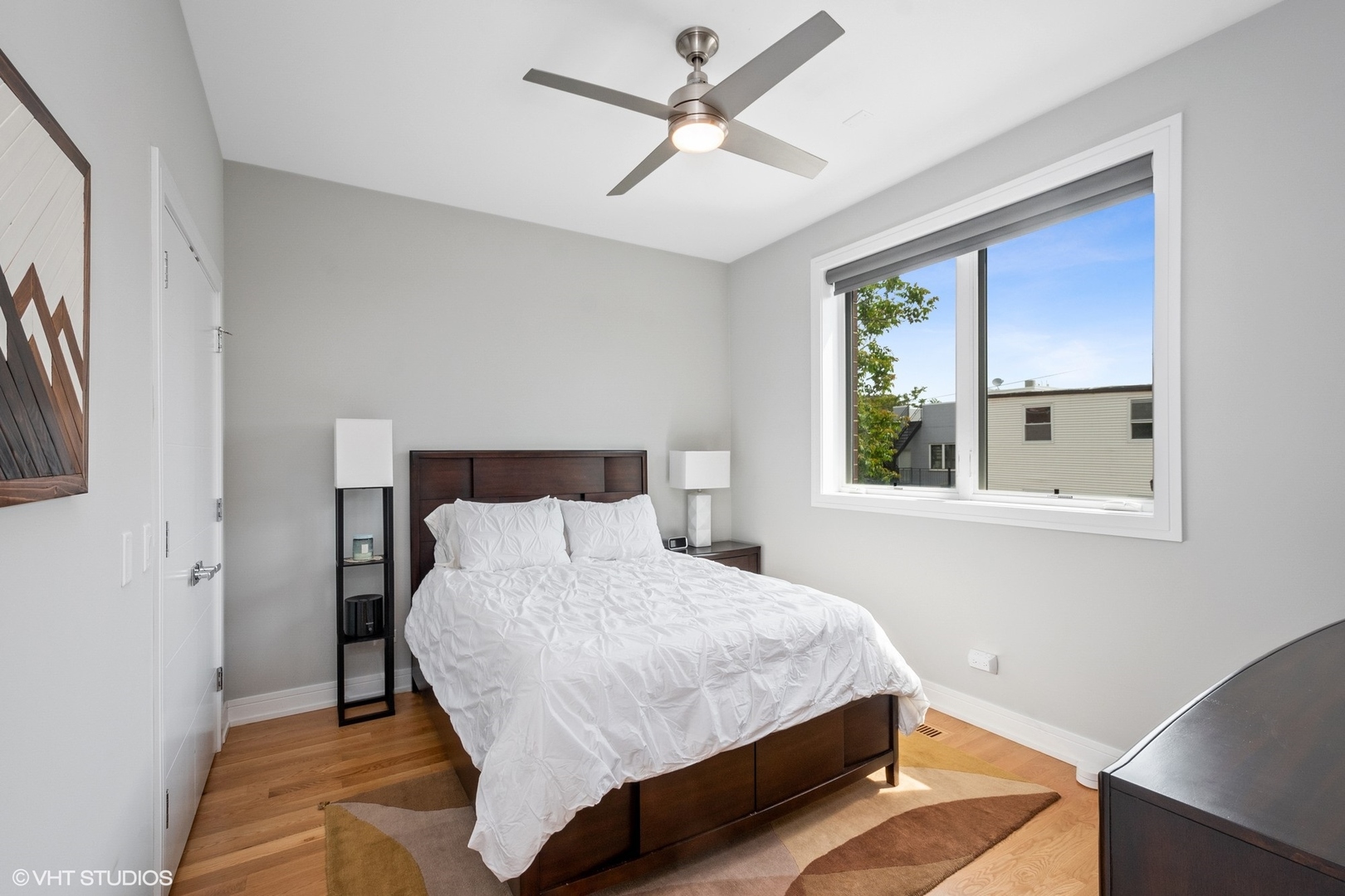 1219 North Cleaver Street, Unit 2 Chicago, IL 60642 - Photo 9 of 23 a bedroom with a bed and a window