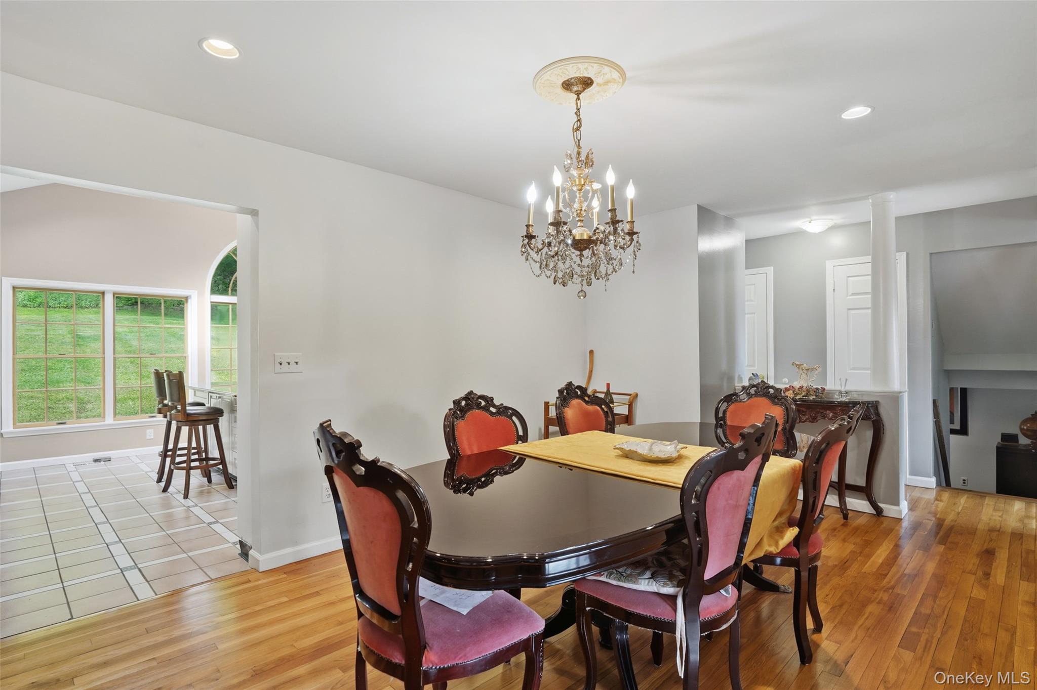 623 Cardinal Road Cortlandt Manor, NY 10567 - Photo 12 of 40 a view of a dining room with furniture a chandelier and wooden floor