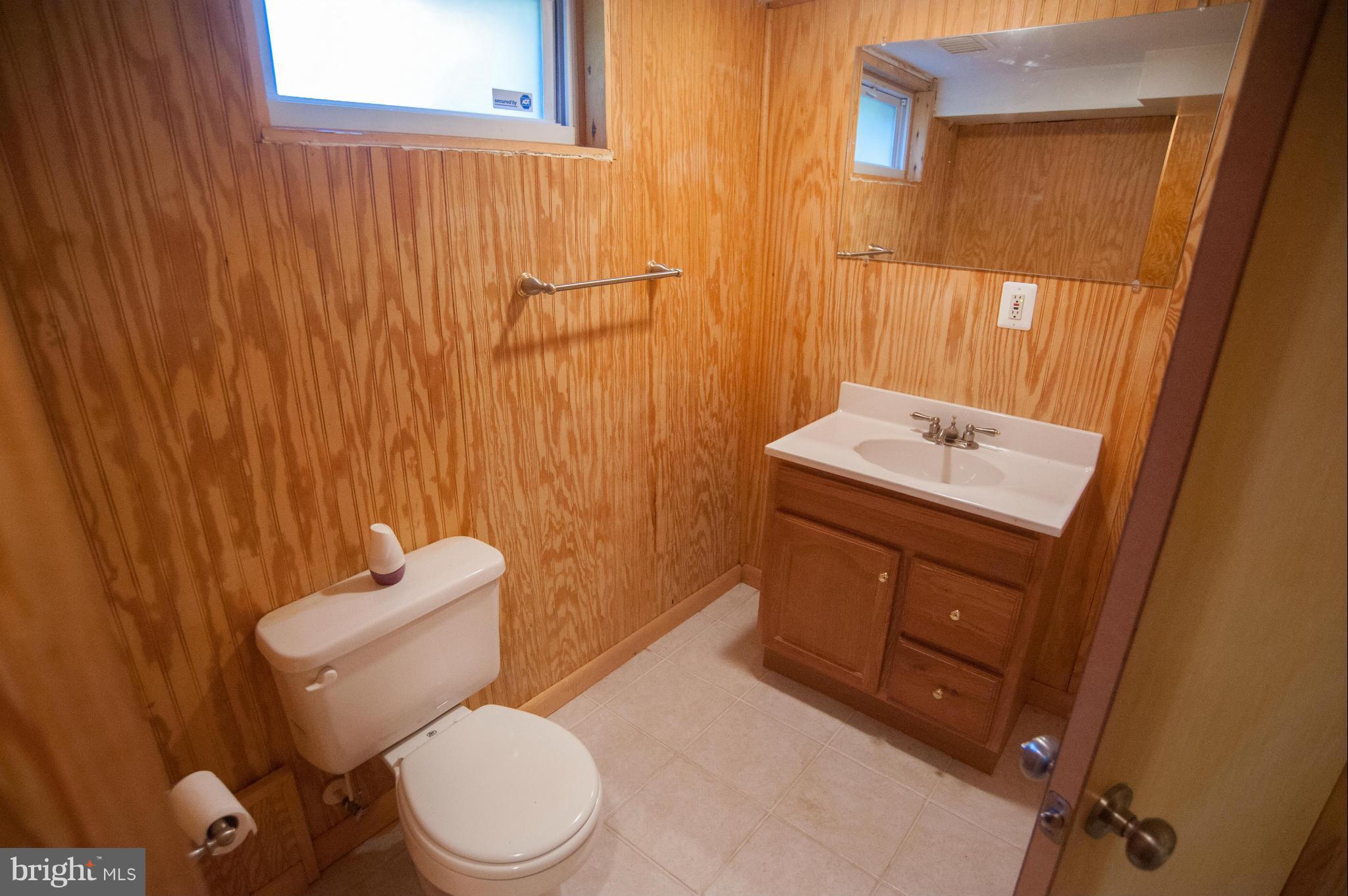 16 Goodrich Road Annapolis, MD 21401 - Photo 15 of 27 a bathroom with a toilet sink vanity and mirror