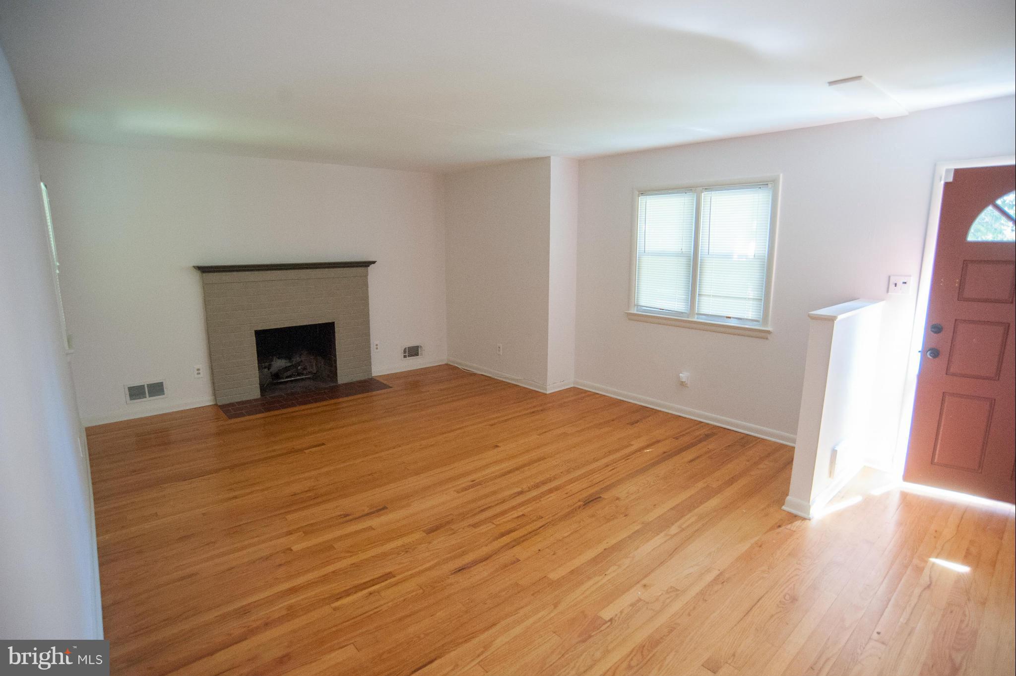 16 Goodrich Road Annapolis, MD 21401 - Photo 3 of 27 an empty room with wooden floor and a window