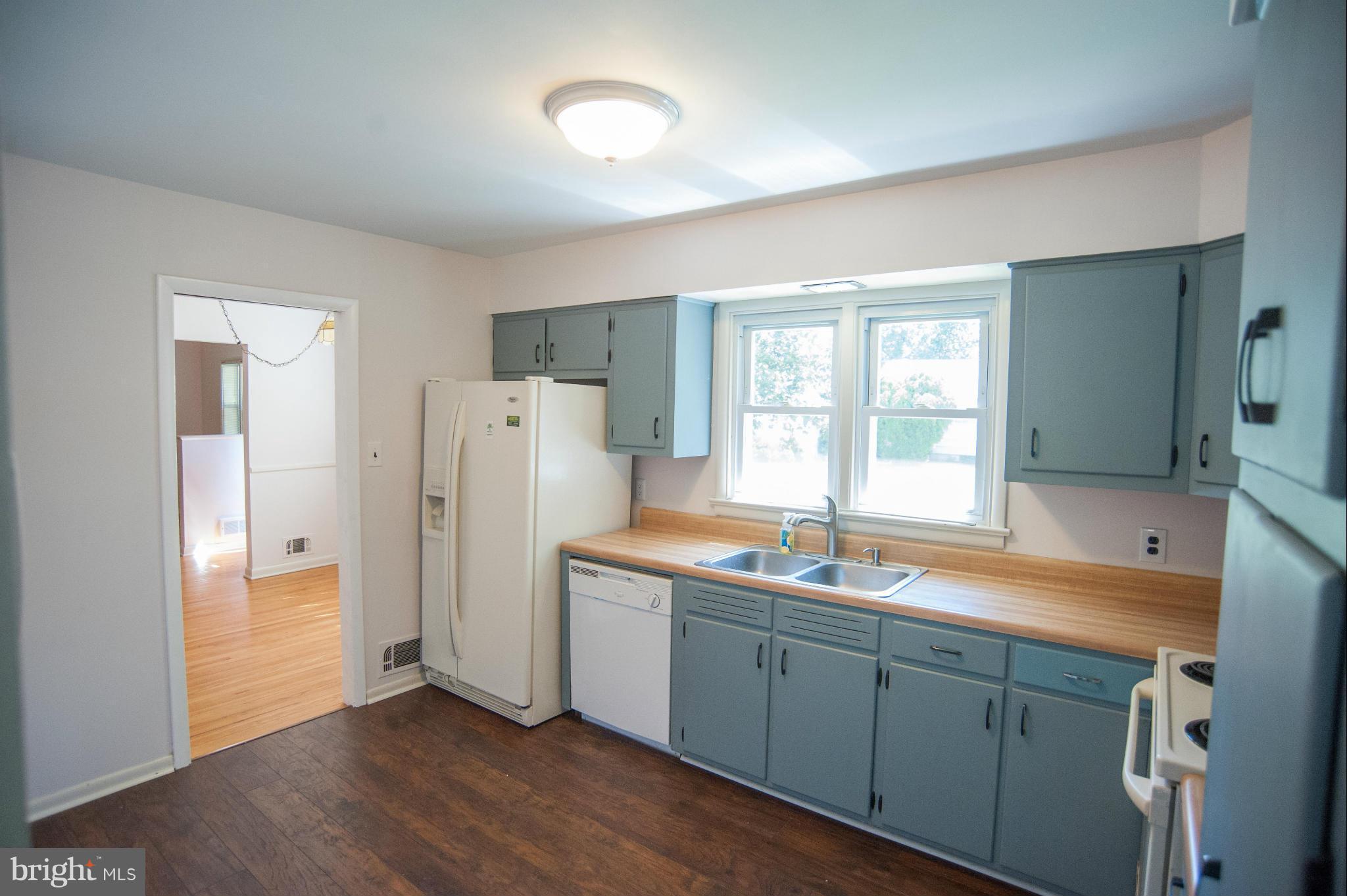 16 Goodrich Road Annapolis, MD 21401 - Photo 7 of 27 a kitchen with a refrigerator sink and cabinets