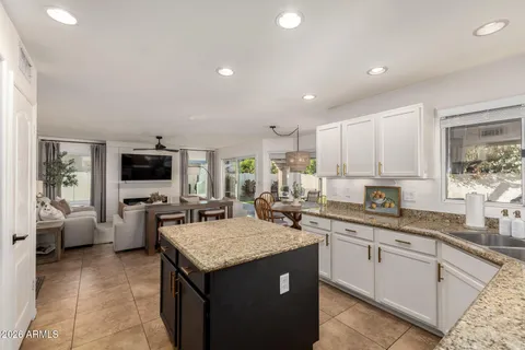 a kitchen with a sink stove and refrigerator