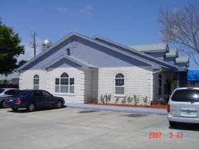1565 Sarno Road, Unit B Melbourne, FL 32935 - Photo 2 of 2 a front view of a house with a yard