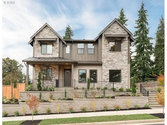 a front view of a house with garage