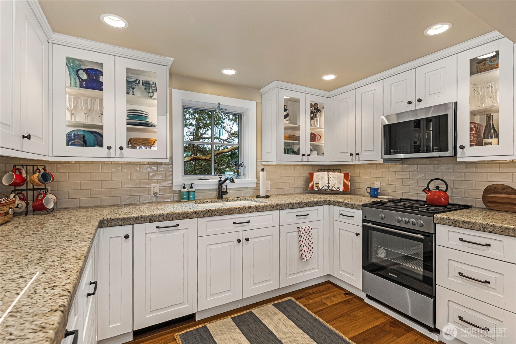 95 Laurel Point Lane Friday Harbor, WA 98250 - Photo 28 of 40 a kitchen with a sink stove and cabinets