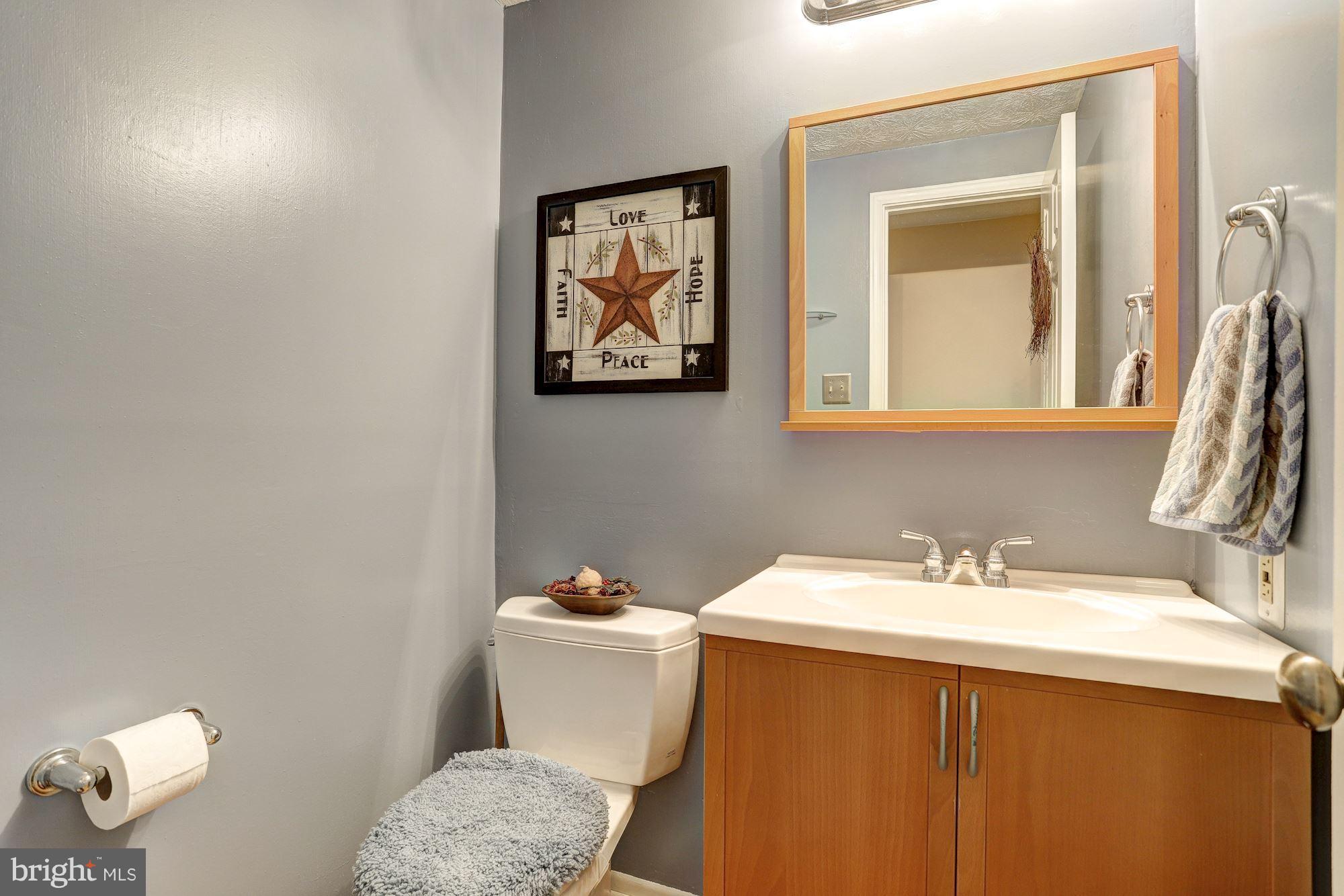 11 Class Court Baltimore, MD 21234 - Photo 12 of 25 a bathroom with a sink mirror vanity and toilet