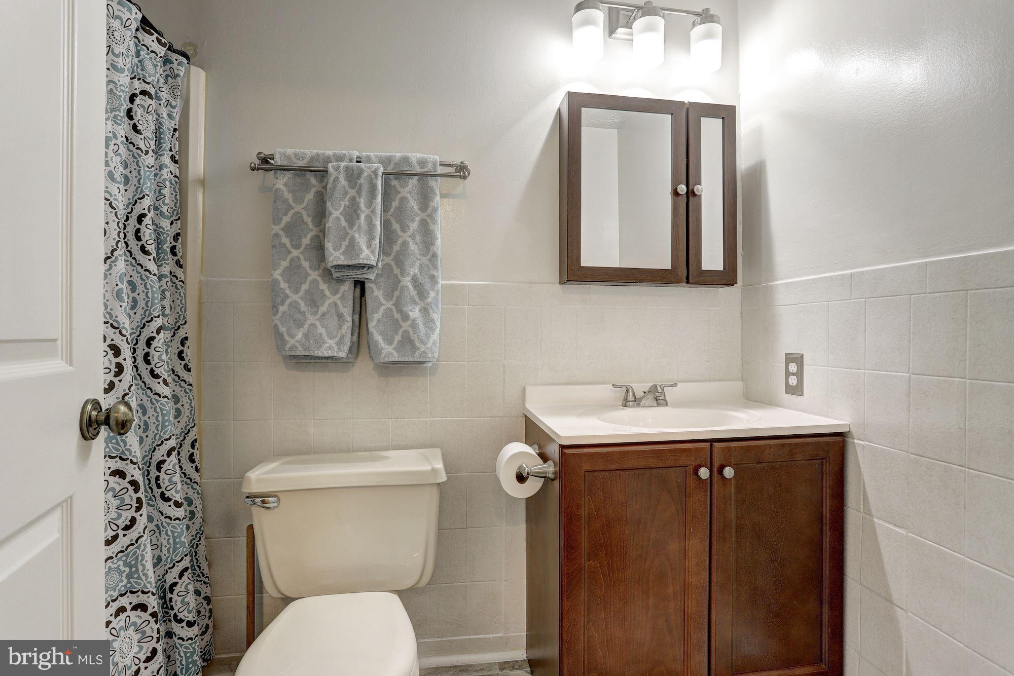 11 Class Court Baltimore, MD 21234 - Photo 17 of 25 a bathroom with a toilet sink and mirror