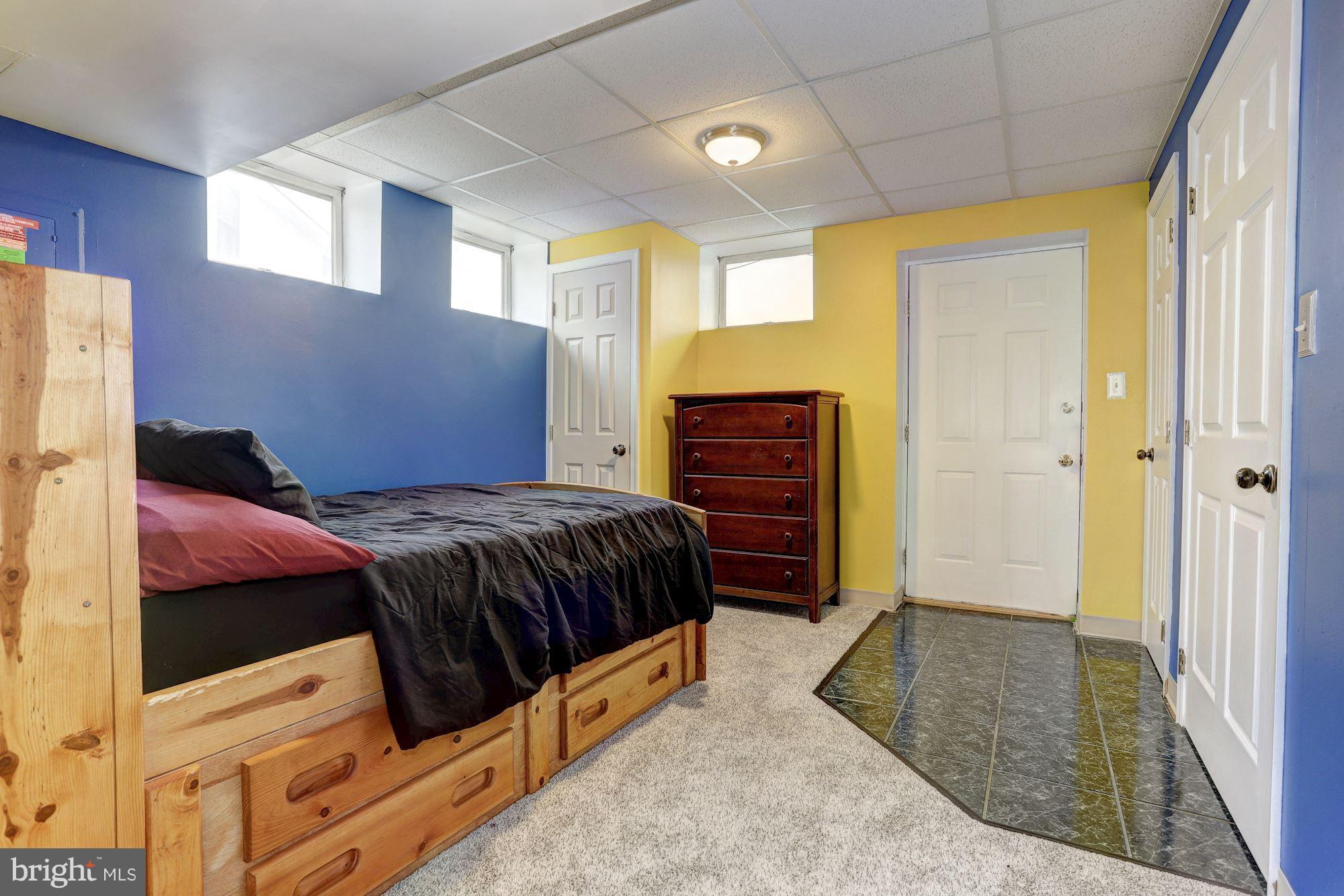 11 Class Court Baltimore, MD 21234 - Photo 19 of 25 a spacious bedroom with a bed and a dresser