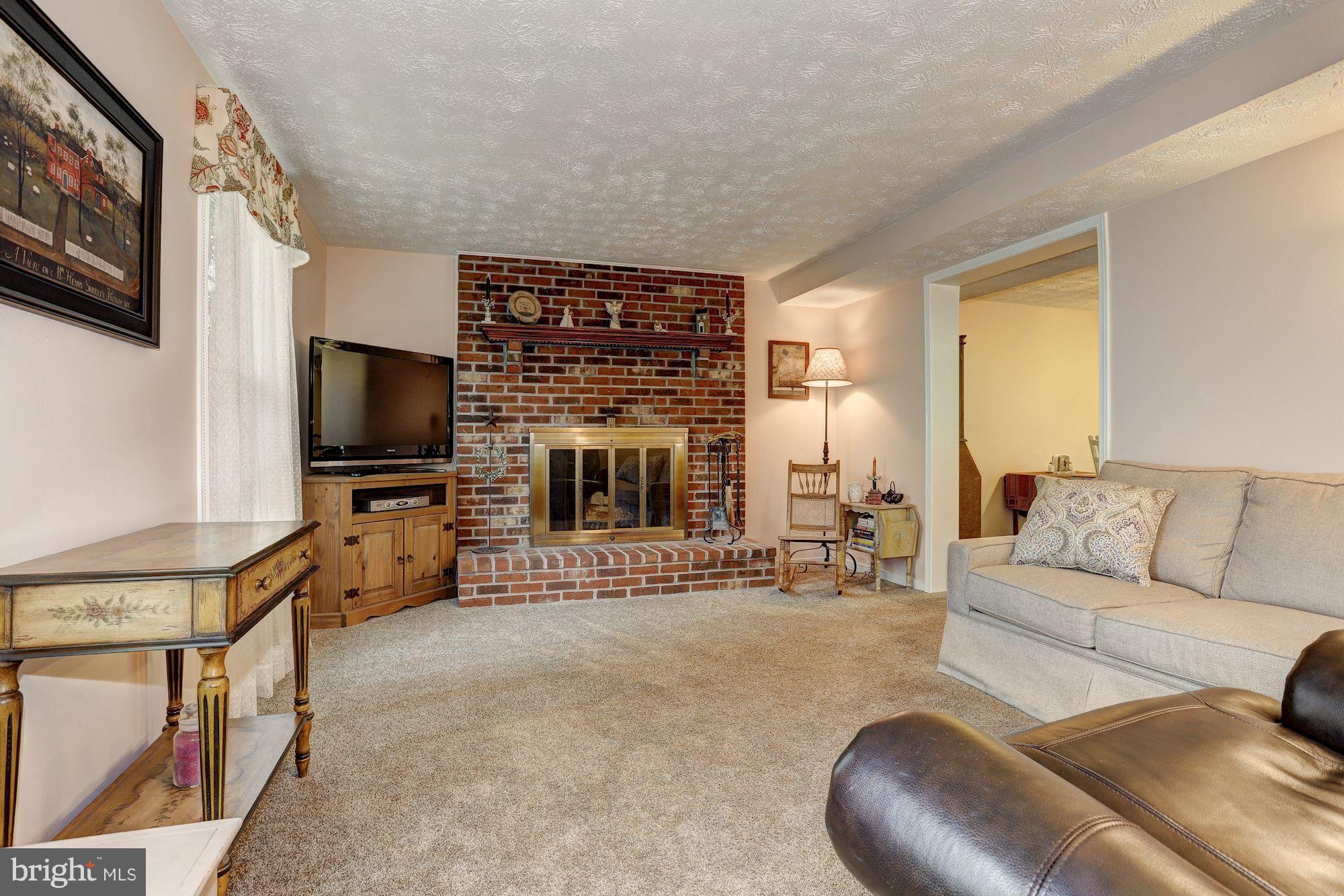 11 Class Court Baltimore, MD 21234 - Photo 3 of 25 a living room with furniture and a flat screen tv